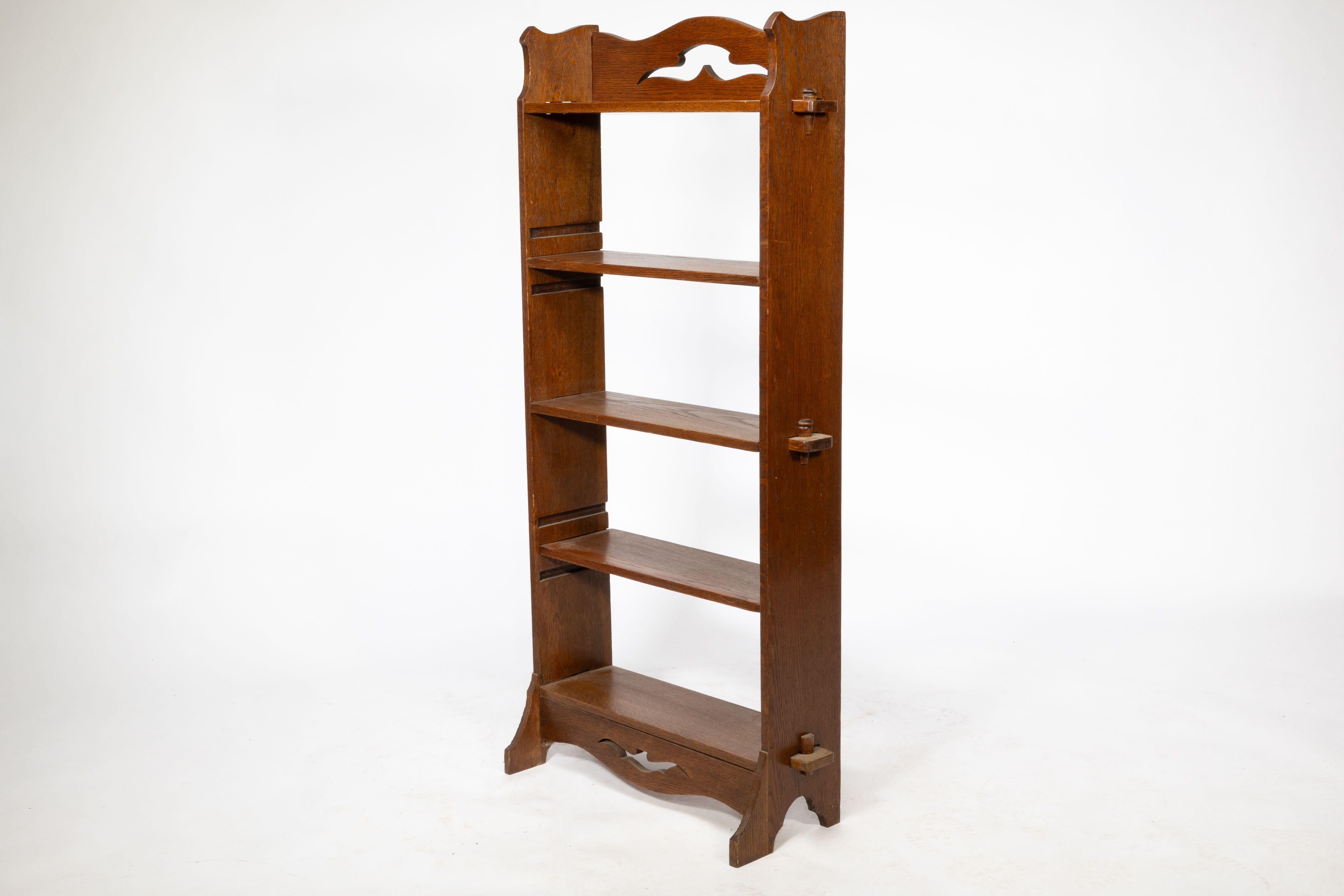 English Liberty and Co. An Arts and Crafts golden oak bookcase flat packed For Sale