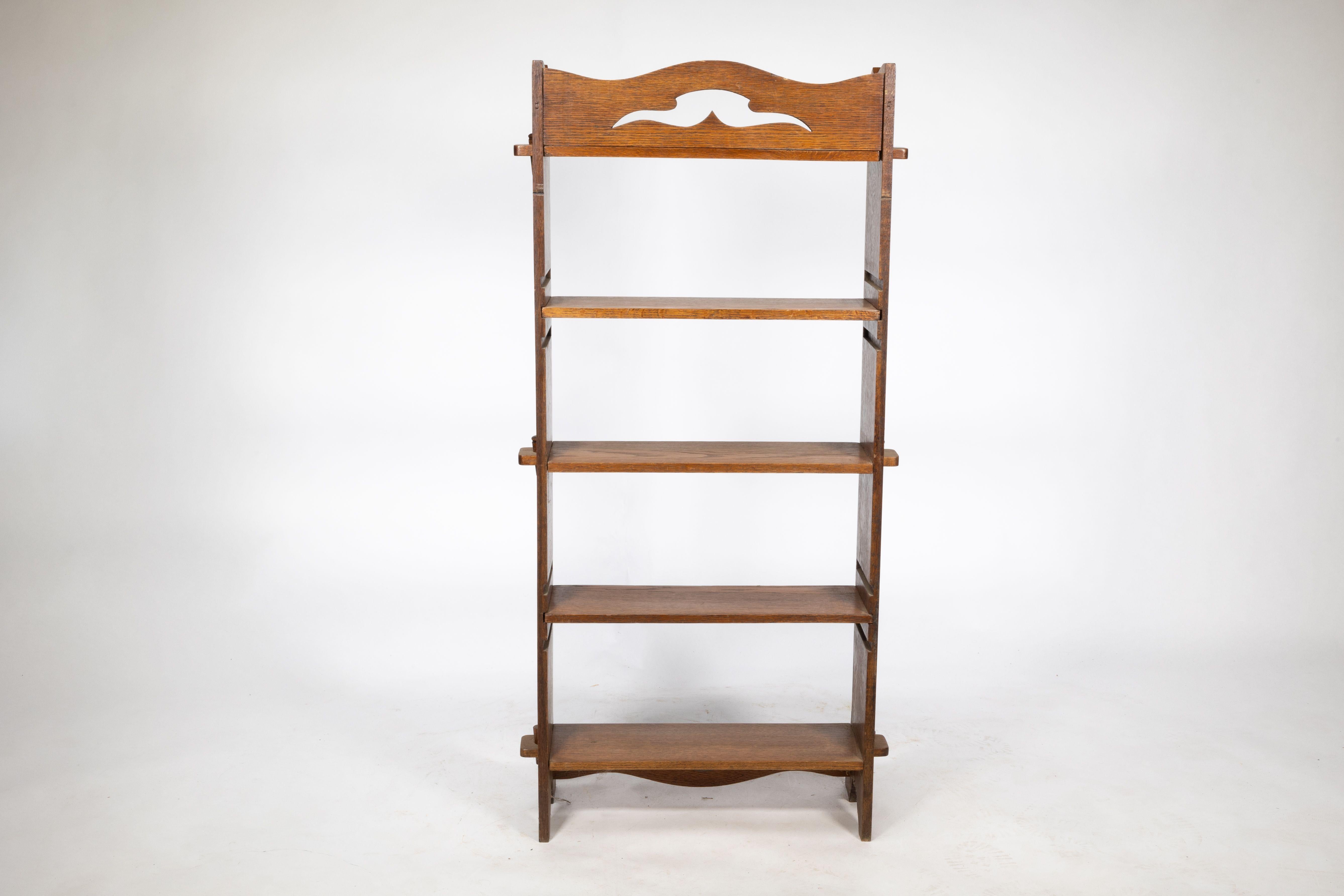 Liberty and Co. An Arts and Crafts golden oak bookcase flat packed For Sale 1