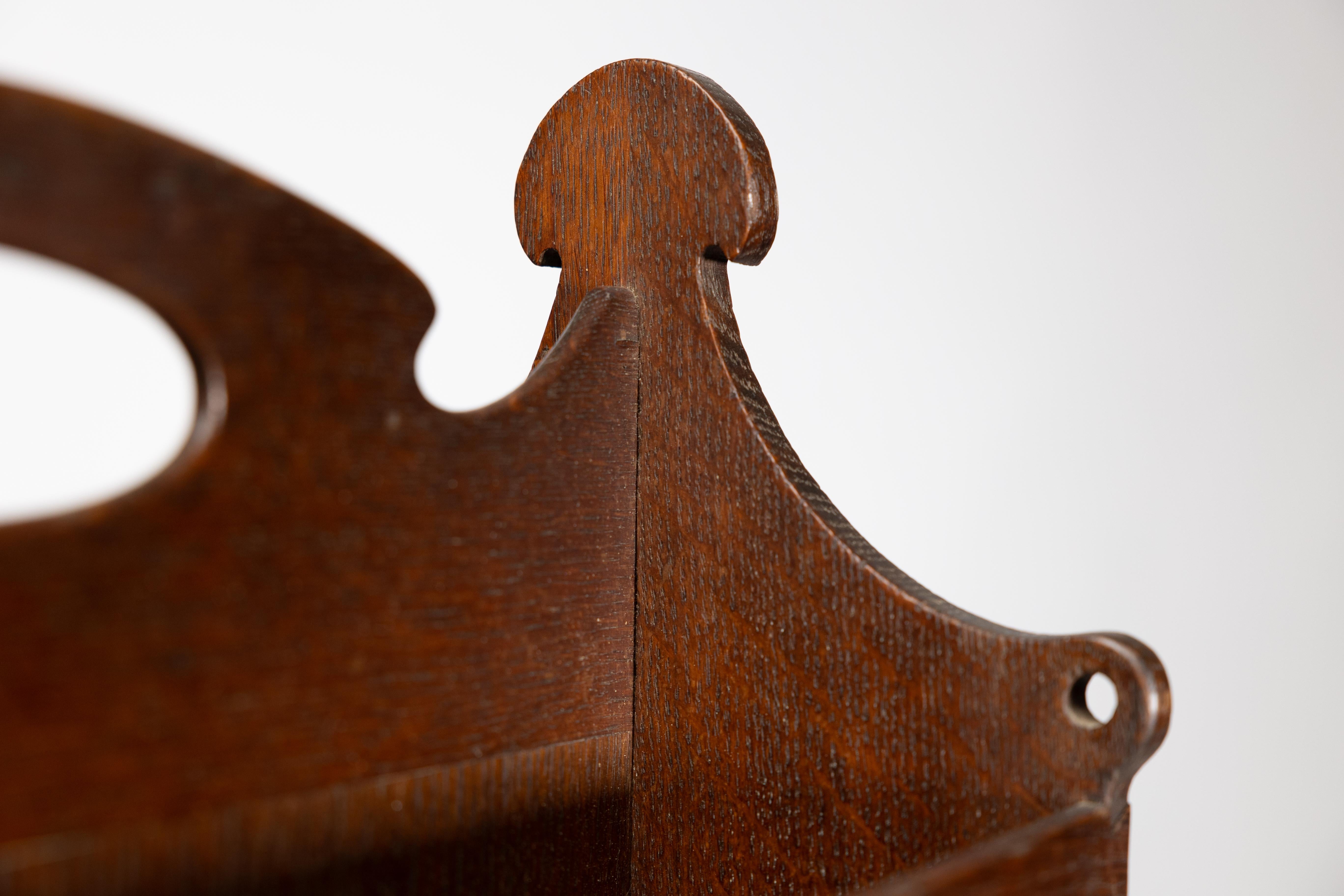 Liberty and Co. An Arts and Crafts oak magazine rack For Sale 4