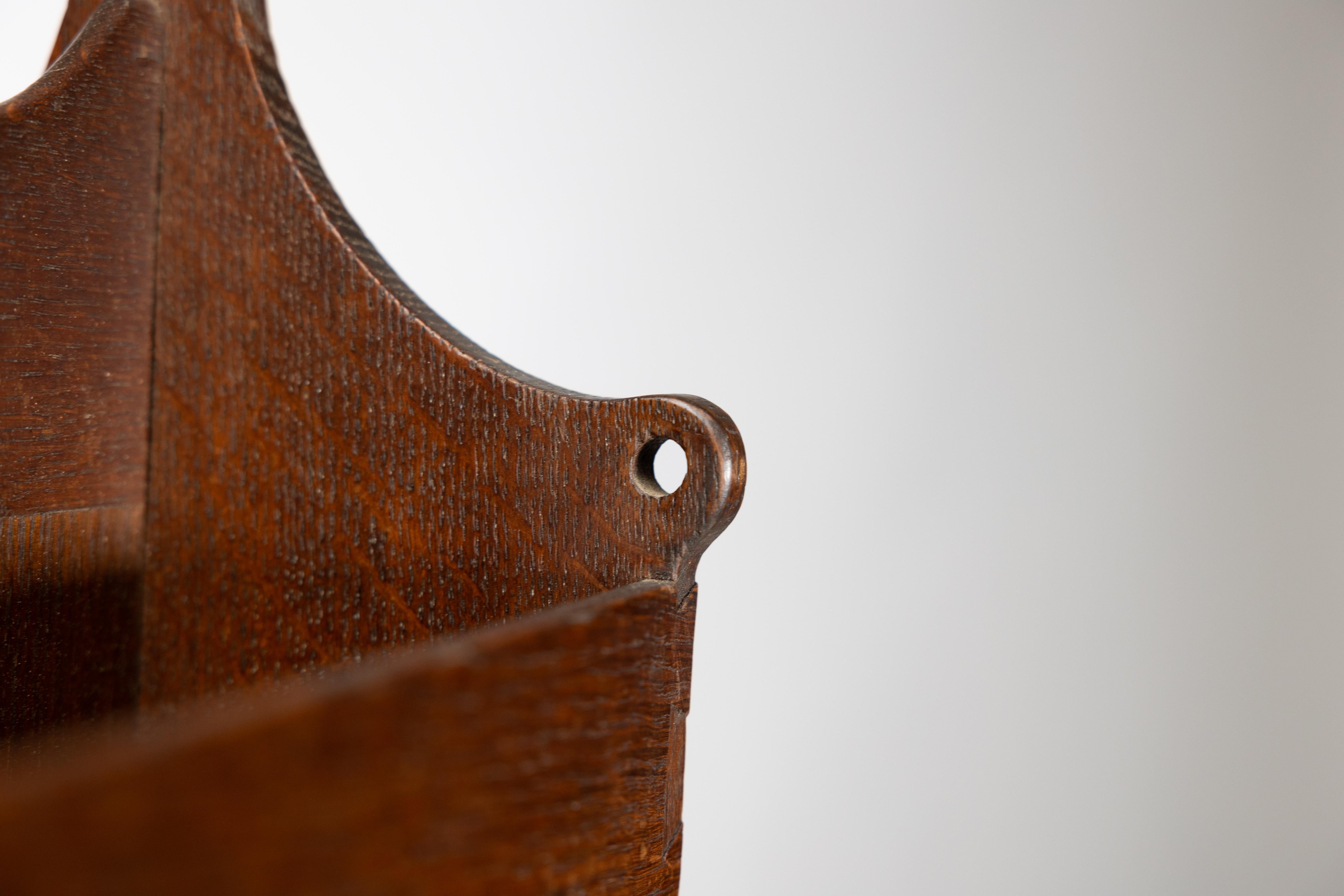 Liberty and Co. An Arts and Crafts oak magazine rack For Sale 6
