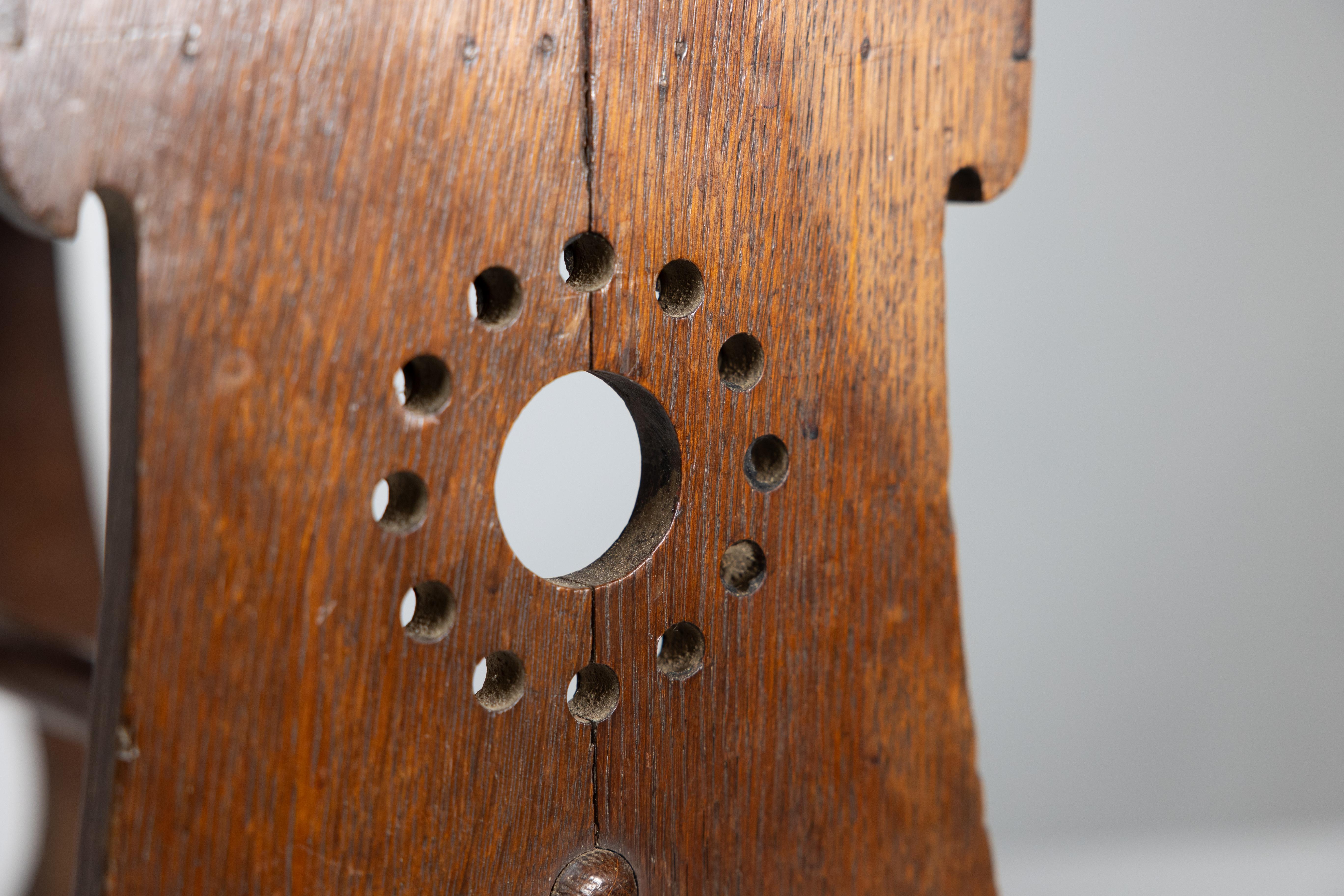 Liberty and Co. An Arts and Crafts oak magazine rack For Sale 8