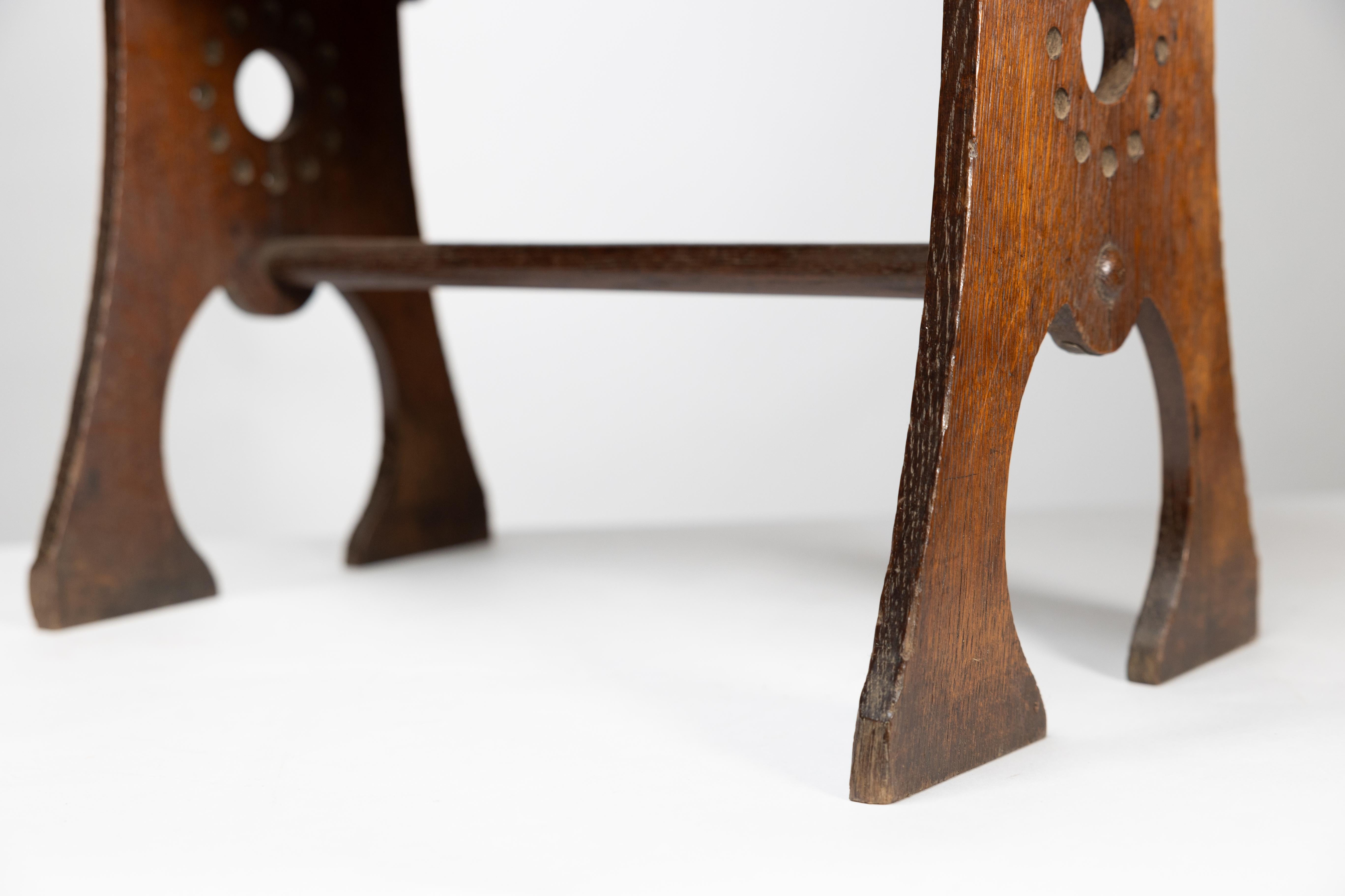Liberty and Co. An Arts and Crafts oak magazine rack For Sale 10