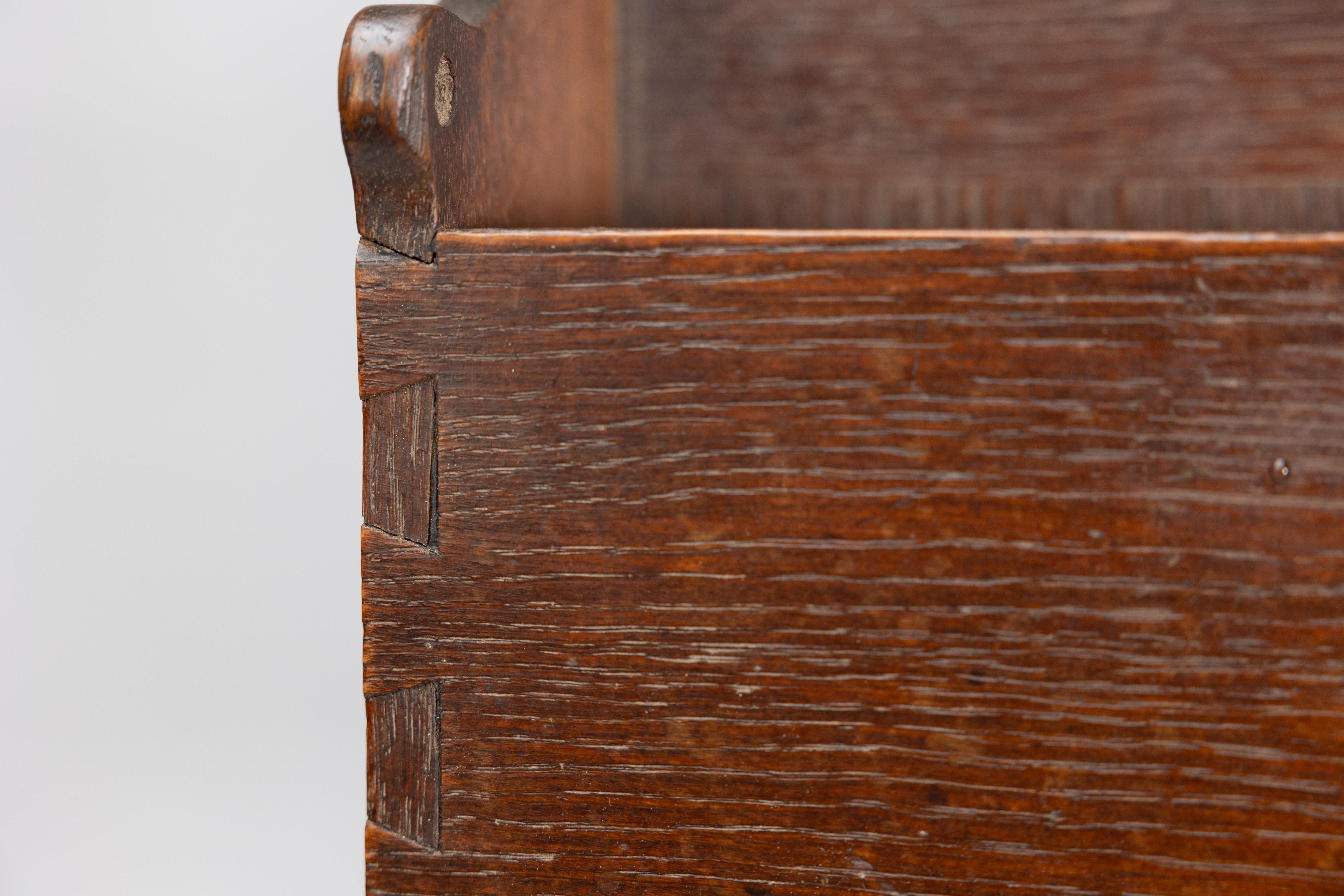 Liberty and Co. An Arts and Crafts oak magazine rack For Sale 11
