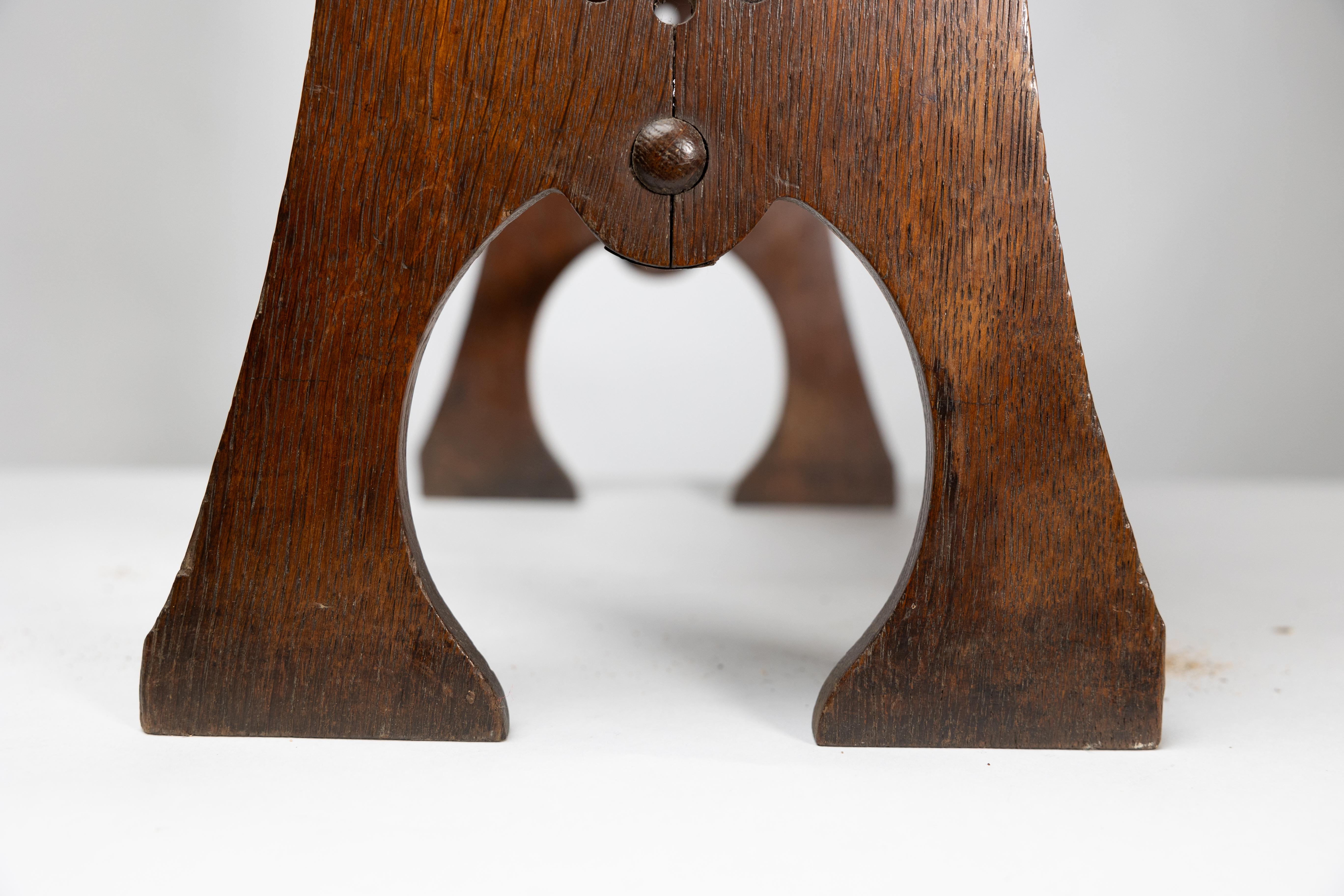 Liberty and Co. An Arts and Crafts oak magazine rack For Sale 13