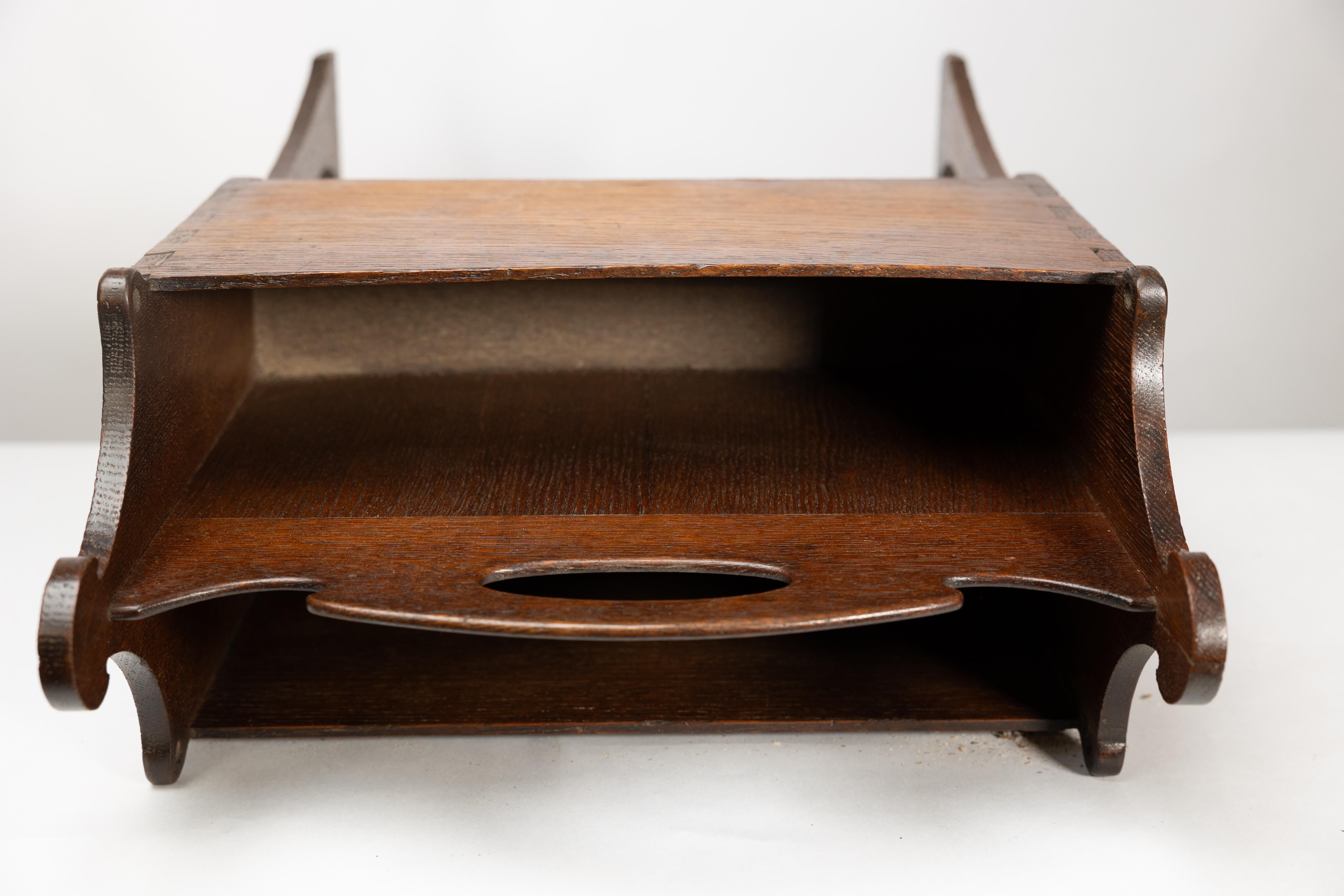 Liberty and Co. An Arts and Crafts oak magazine rack For Sale 14
