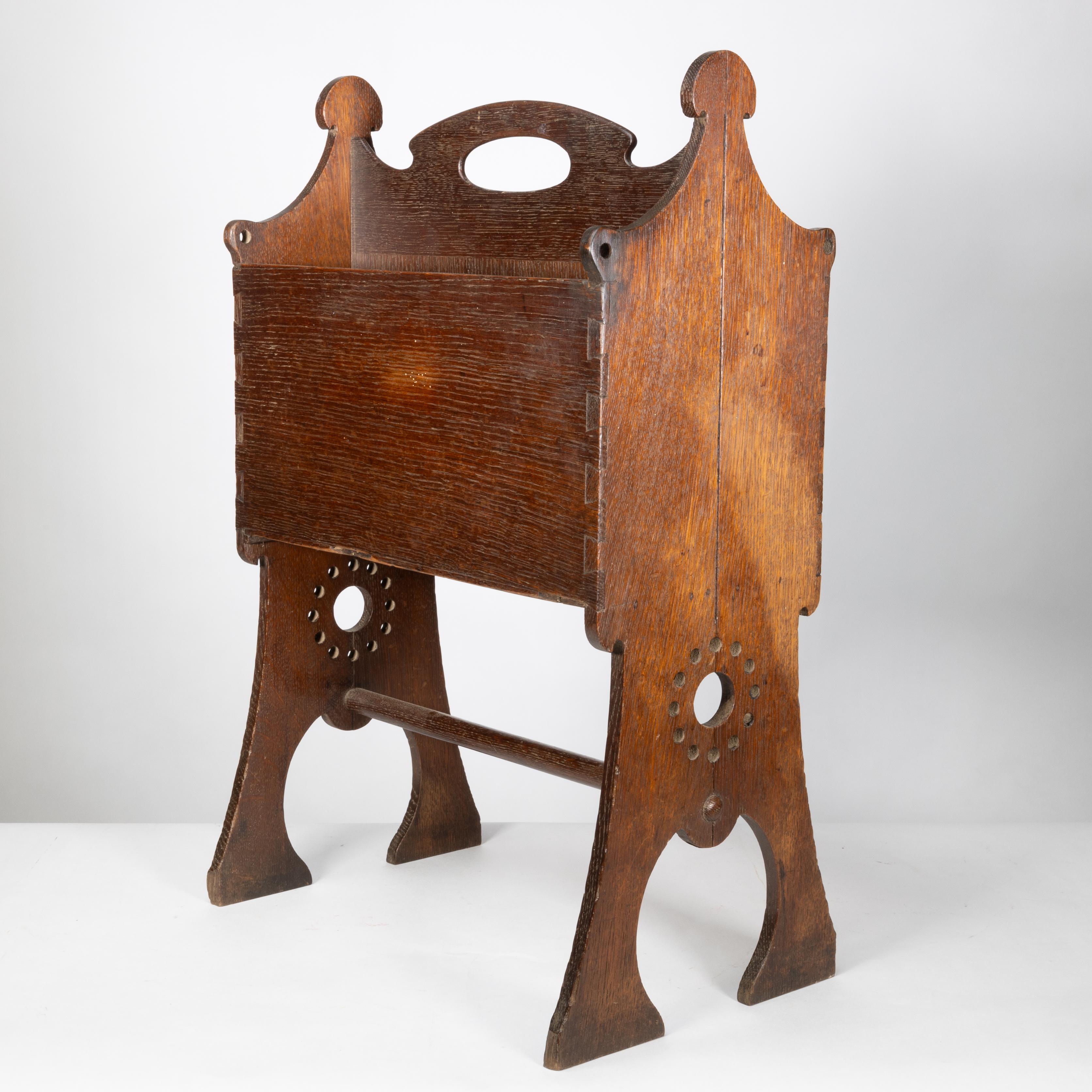 Liberty and Co. An Arts and Crafts oak magazine rack In Good Condition For Sale In London, GB