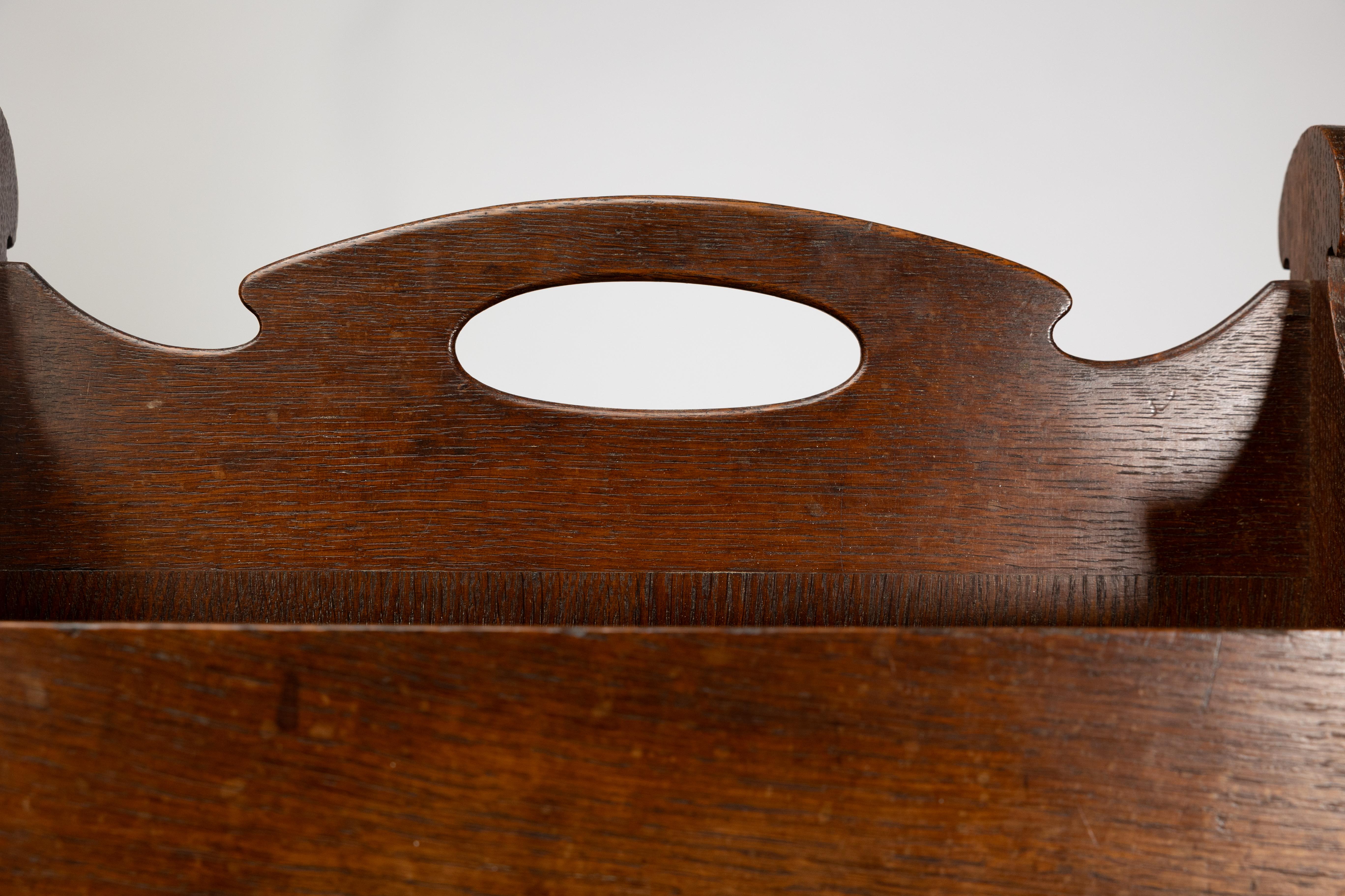 Liberty and Co. An Arts and Crafts oak magazine rack For Sale 2