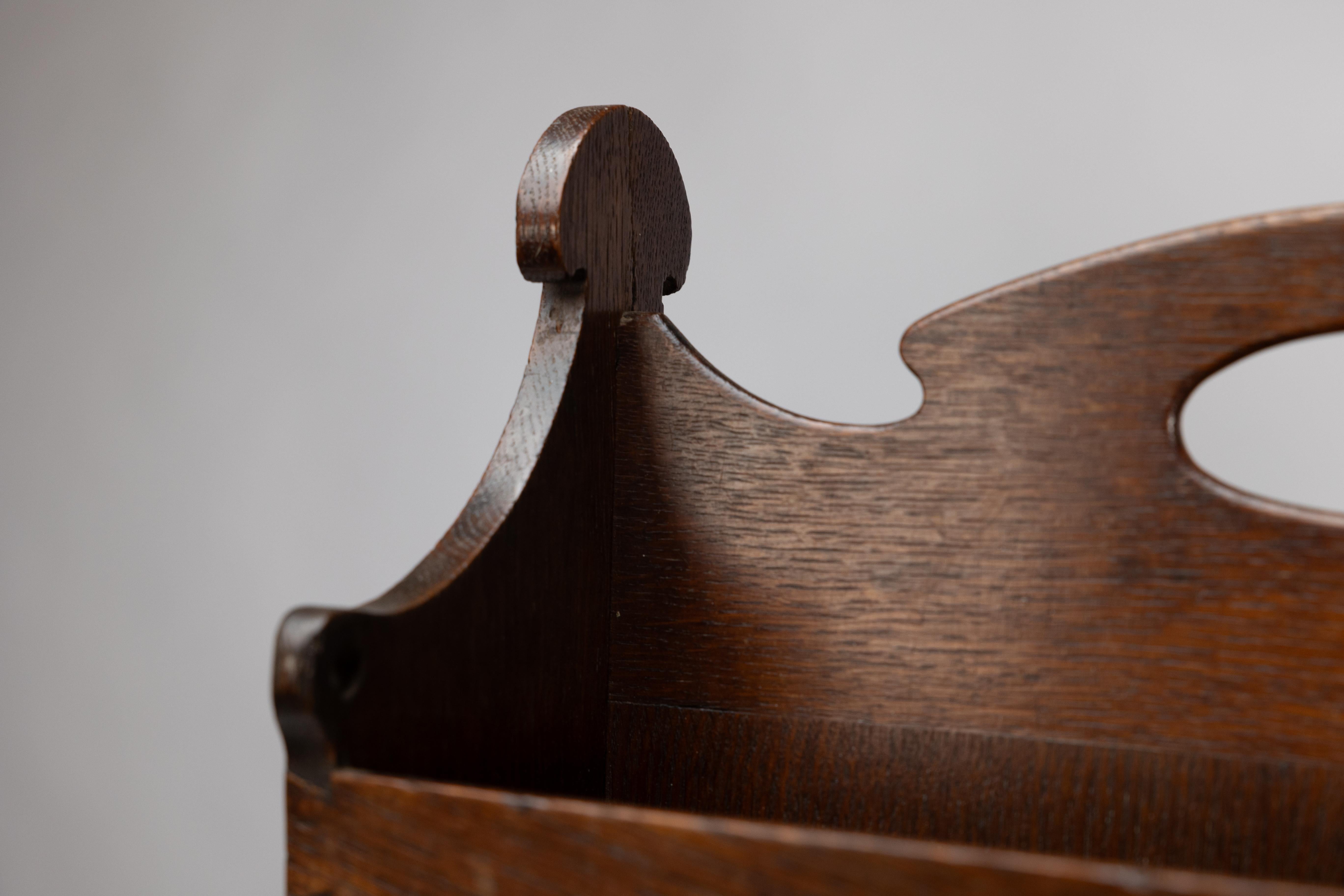 Liberty and Co. An Arts and Crafts oak magazine rack For Sale 3