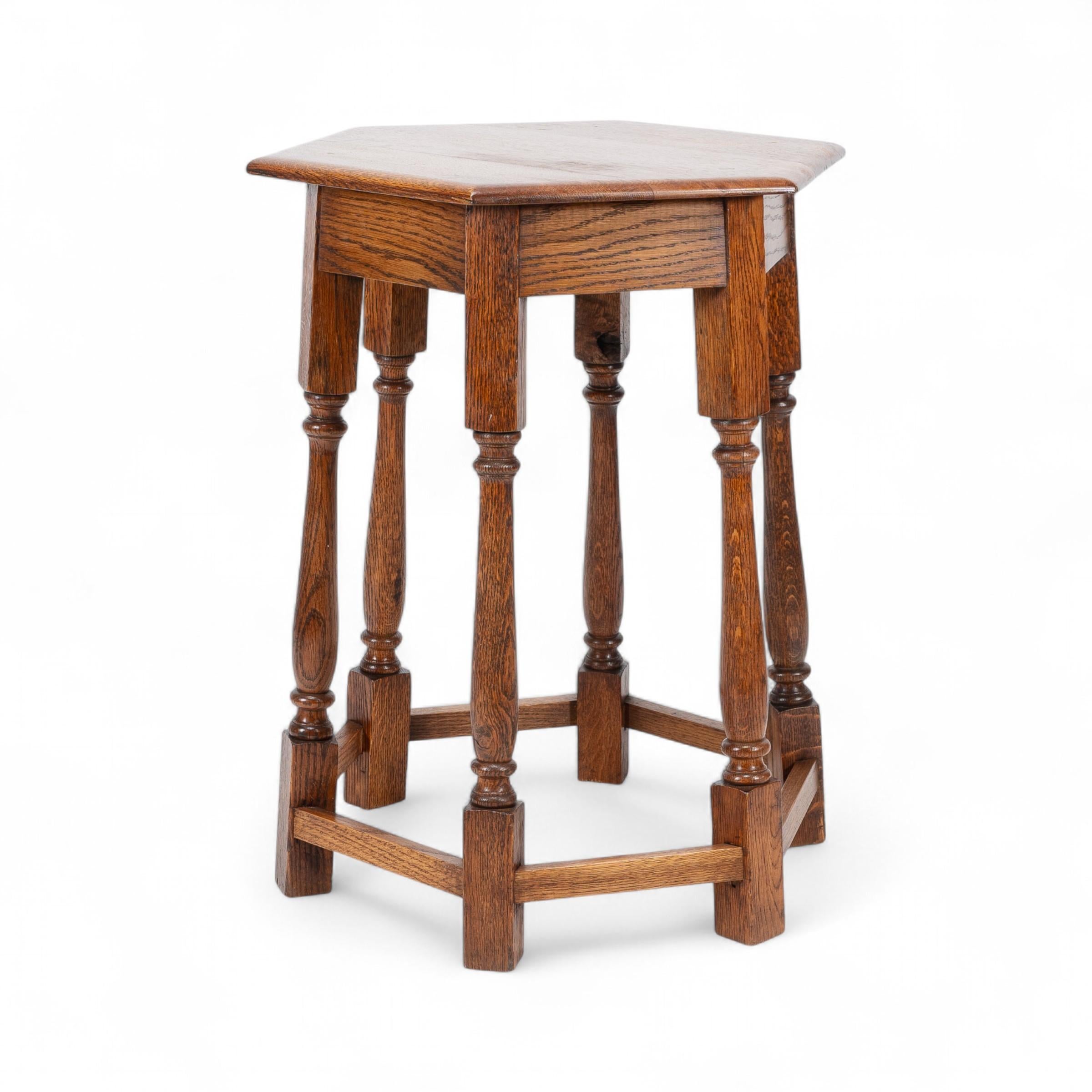 British Liberty and Co. An Arts and Crafts oak side table with a hexagonal top For Sale