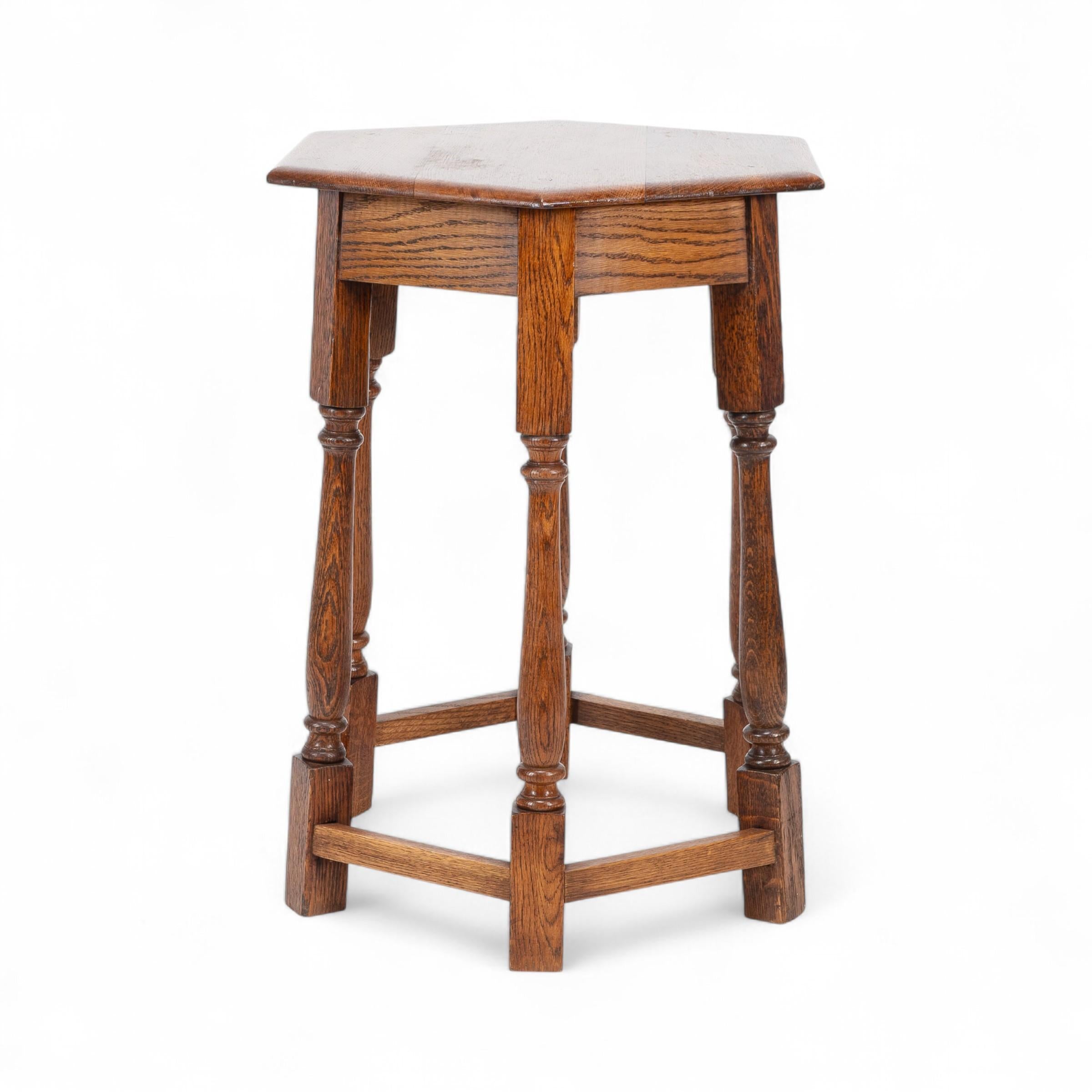Hand-Crafted Liberty and Co. An Arts and Crafts oak side table with a hexagonal top For Sale