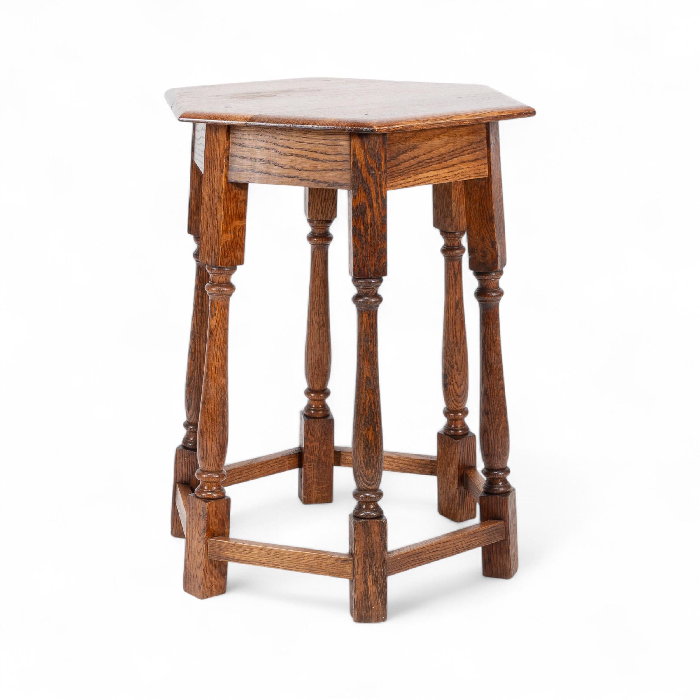 20th Century Liberty and Co. An Arts and Crafts oak side table with a hexagonal top For Sale