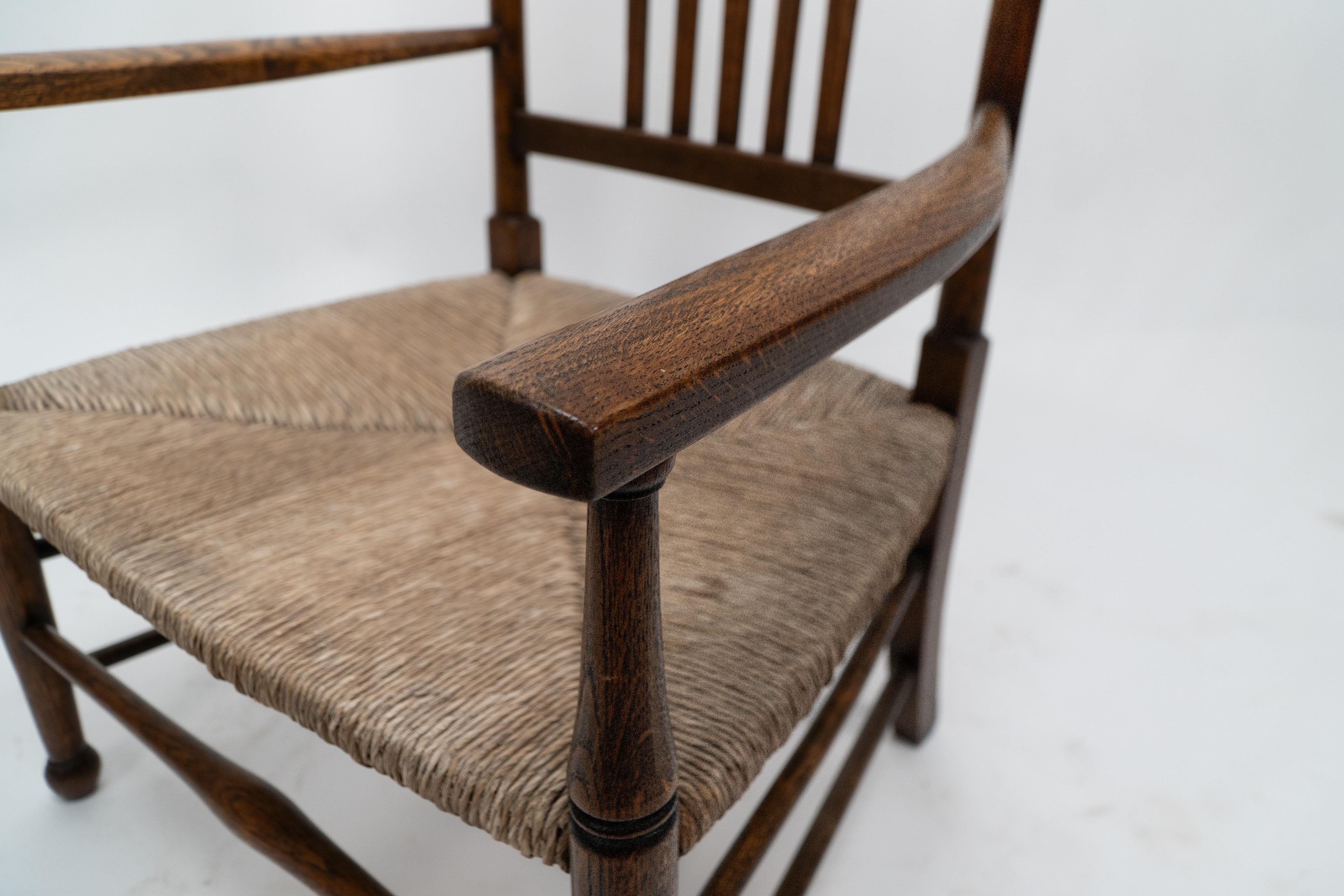 Liberty and Co. An Arts and Crafts rush seat armchair For Sale 4