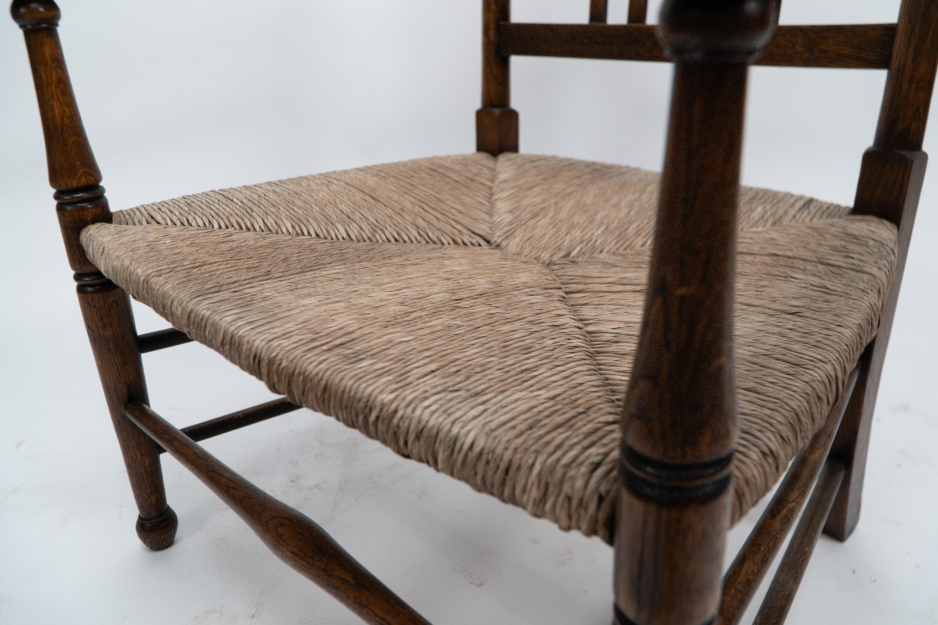 Liberty and Co. An Arts and Crafts rush seat armchair For Sale 10