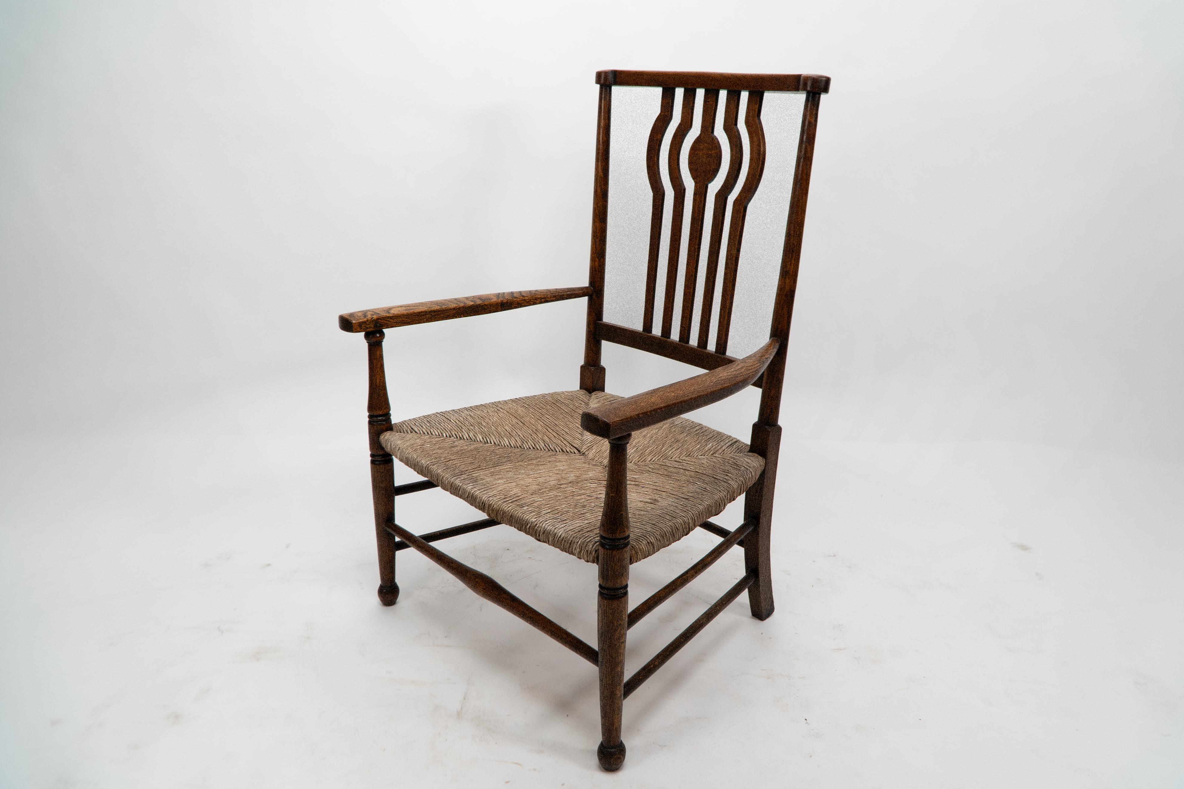 Late 19th Century Liberty and Co. An Arts and Crafts rush seat armchair For Sale