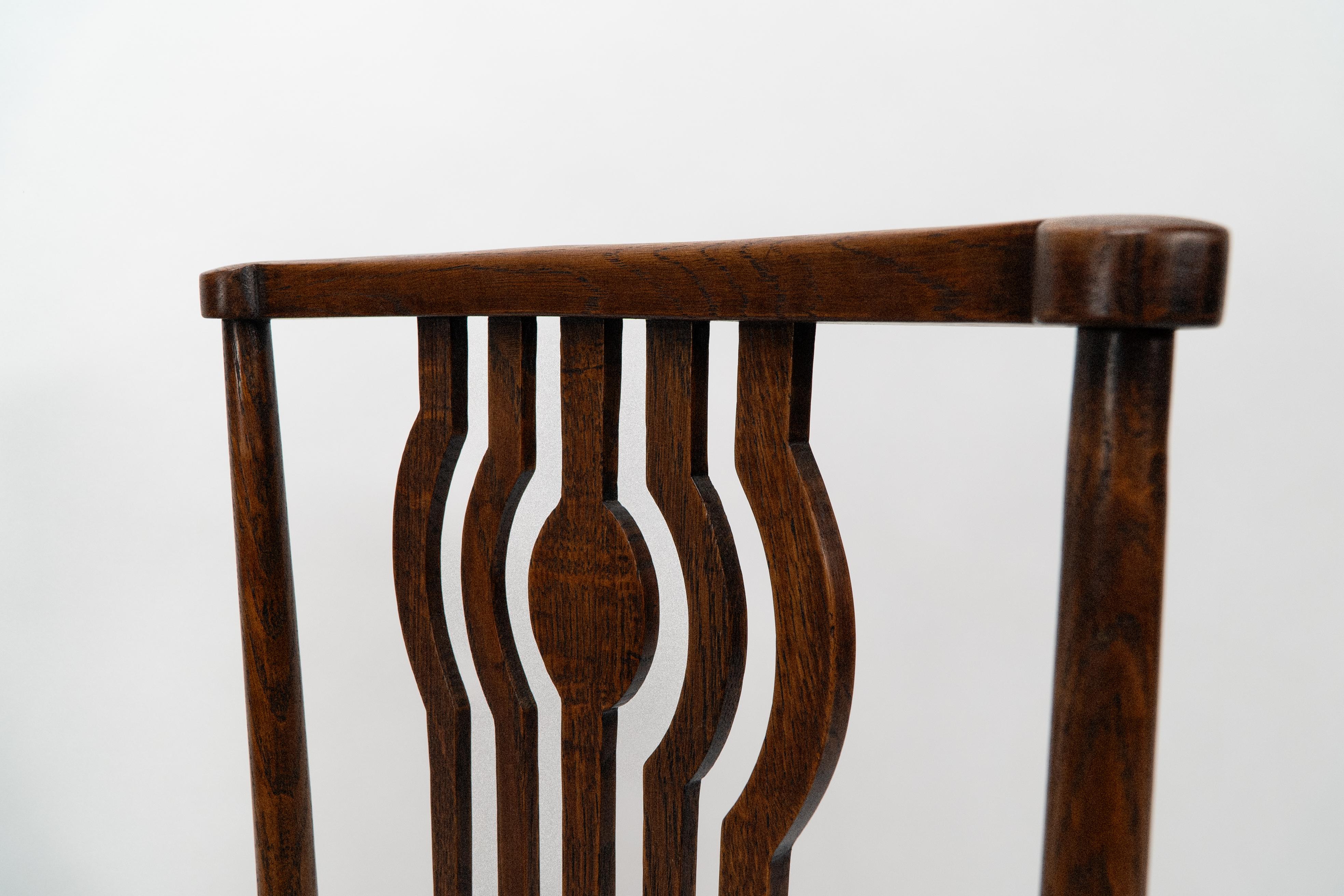 Rush Liberty and Co. An Arts and Crafts rush seat armchair For Sale