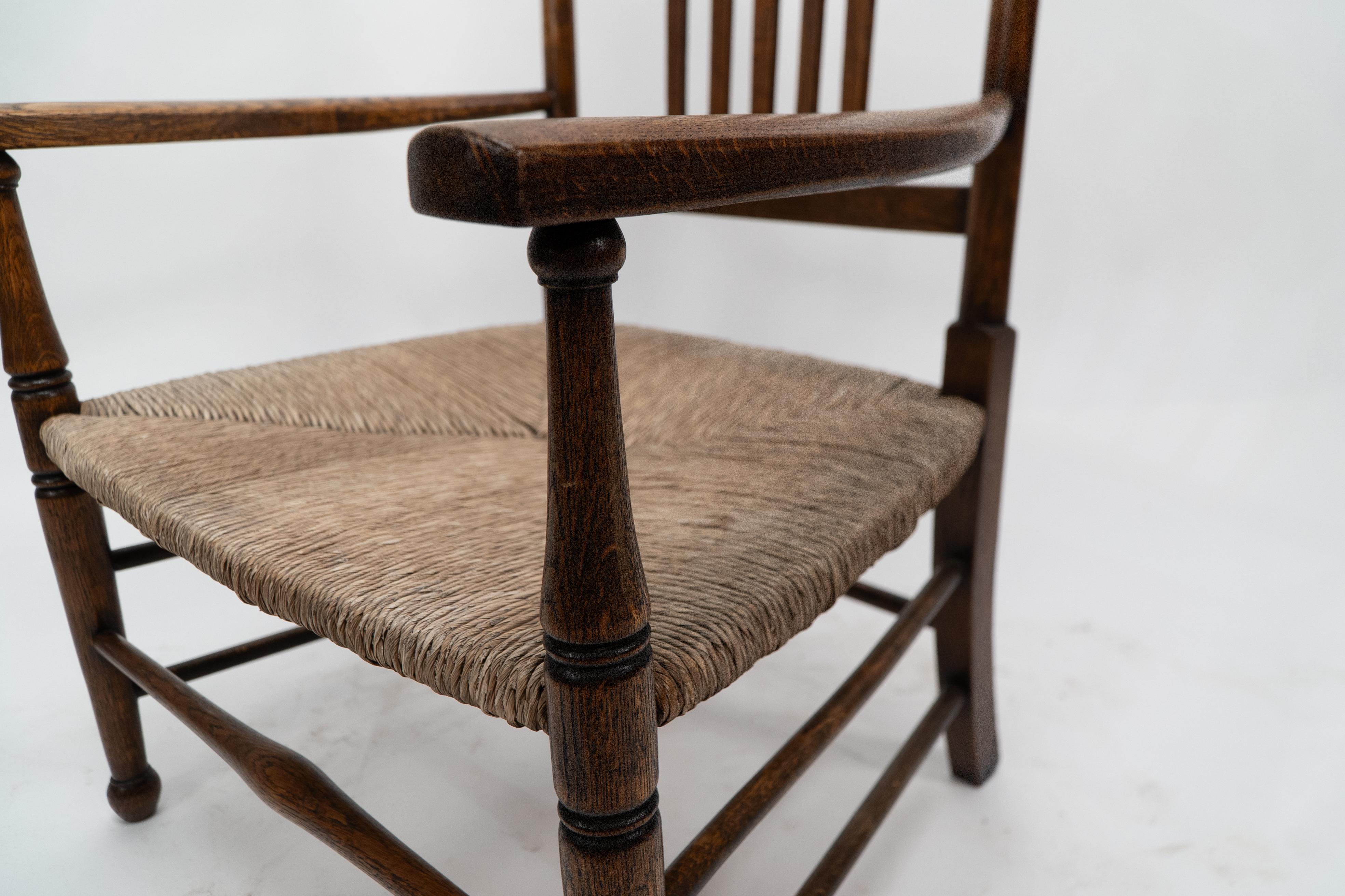Liberty and Co. An Arts and Crafts rush seat armchair For Sale 3