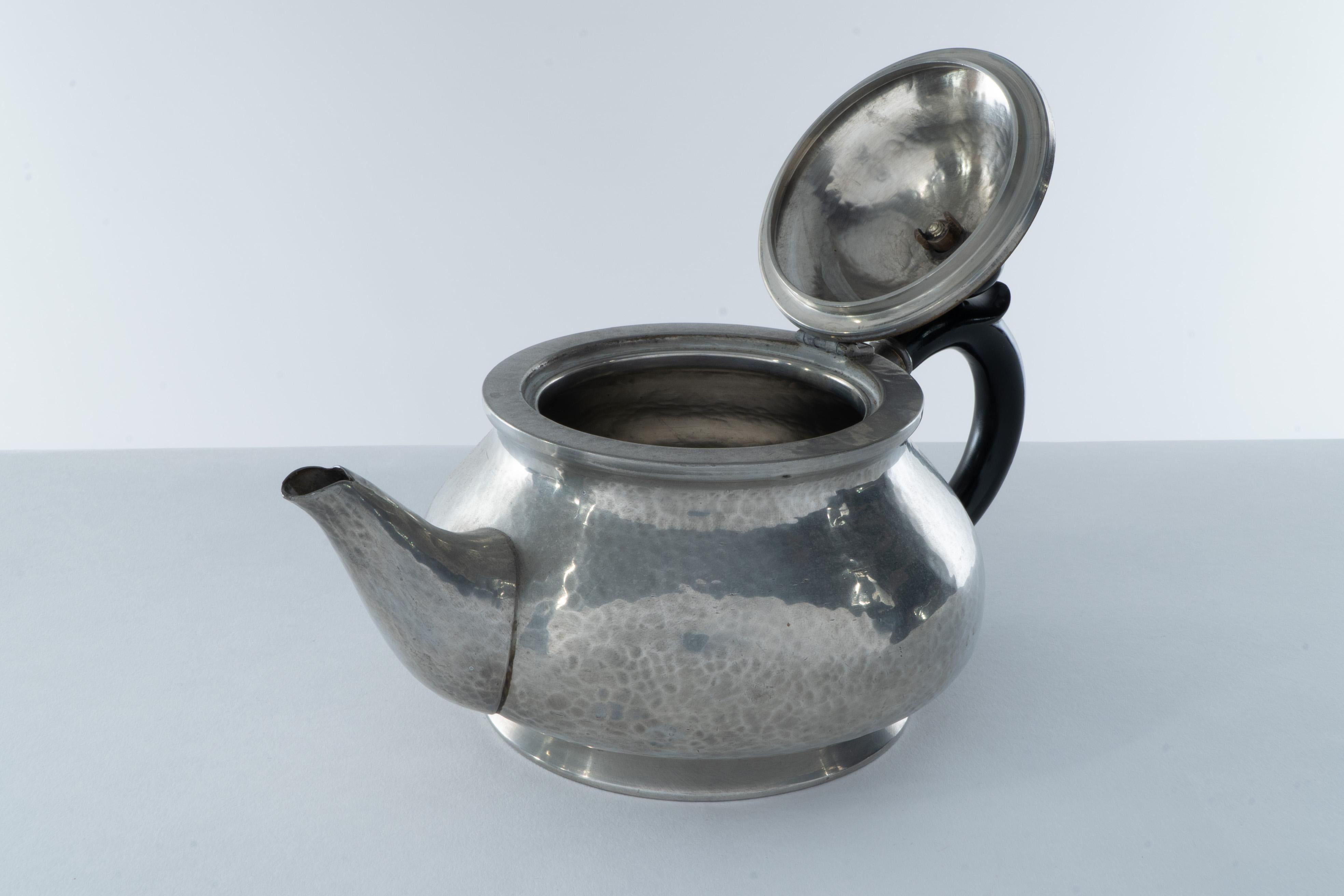 Early 20th Century Liberty and Co. An Arts and Crafts six piece pewter tudric tea set For Sale
