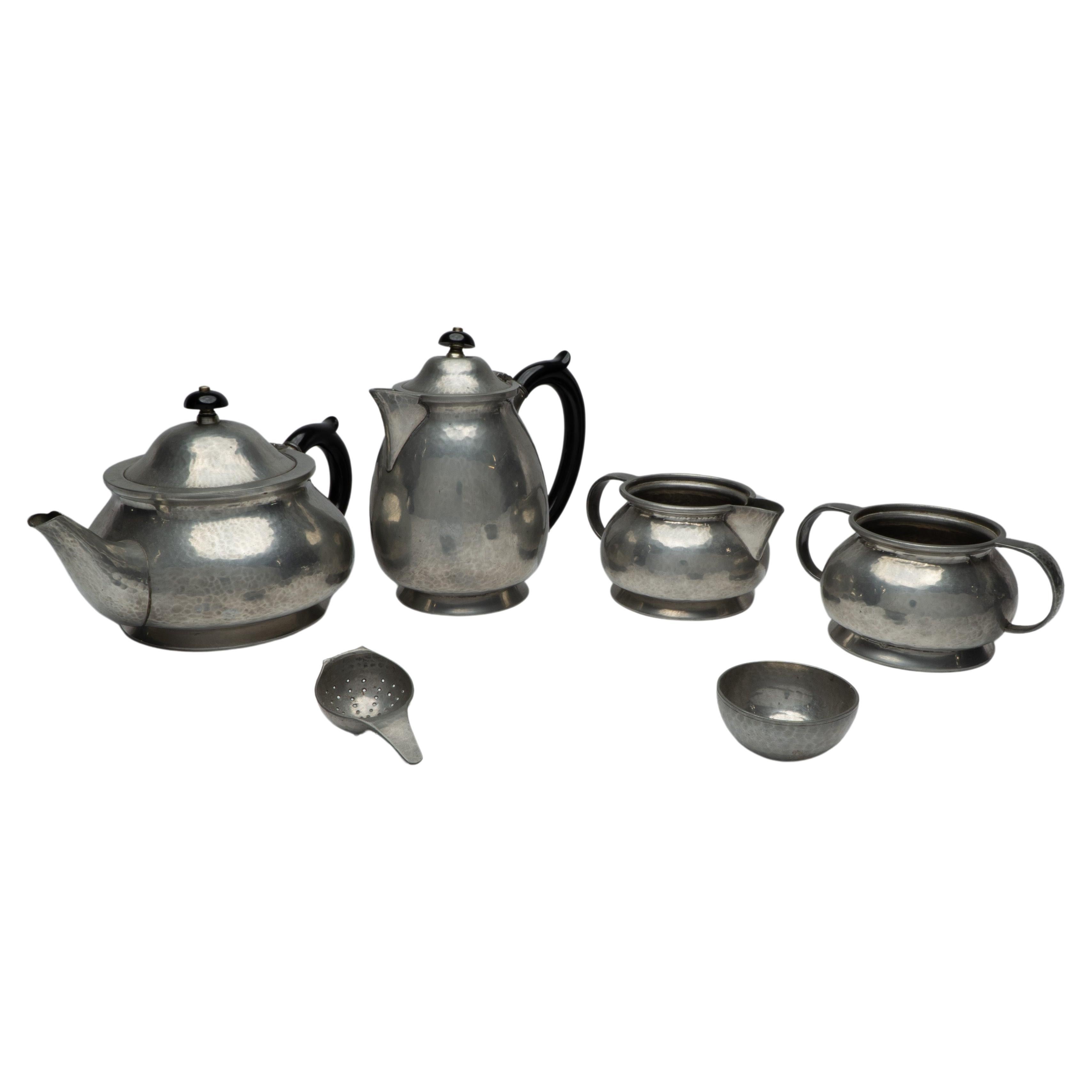 Liberty and Co. An Arts and Crafts six piece pewter tudric tea set