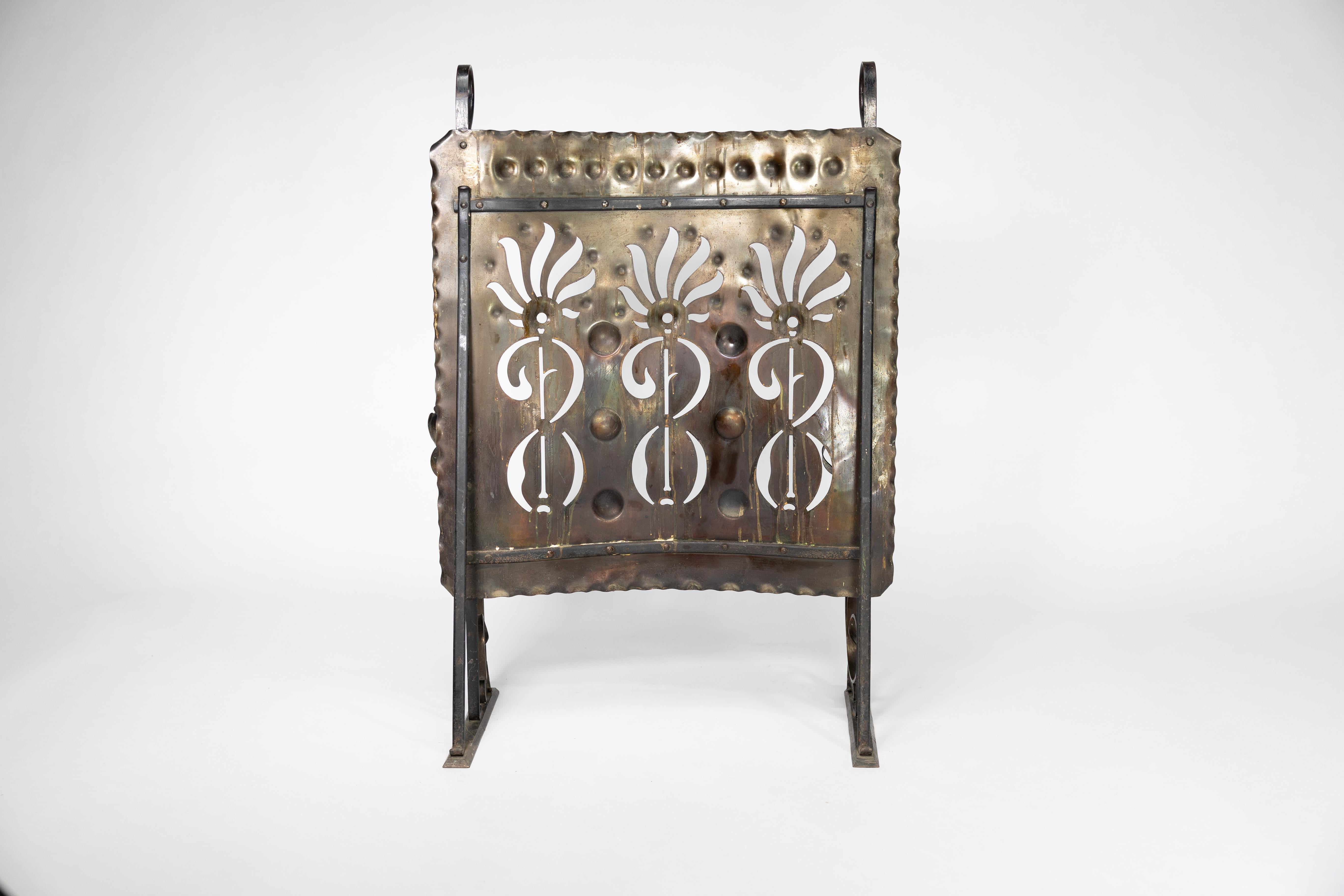 Early 20th Century Liberty & Co. An Arts & Crafts wrought iron & copper pierced floral firescreen. For Sale