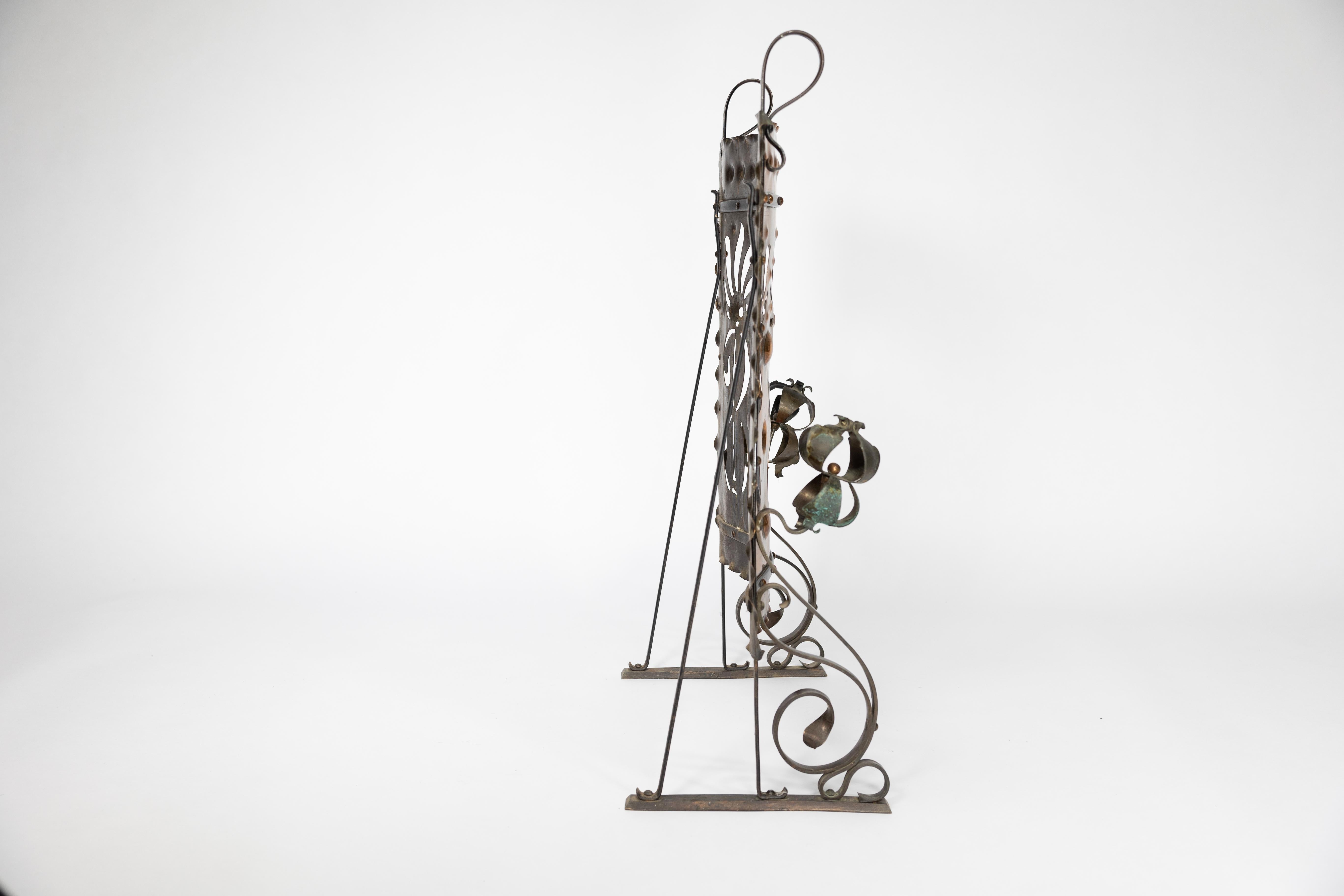 English Liberty & Co. An Arts & Crafts wrought iron & copper pierced floral firescreen. For Sale