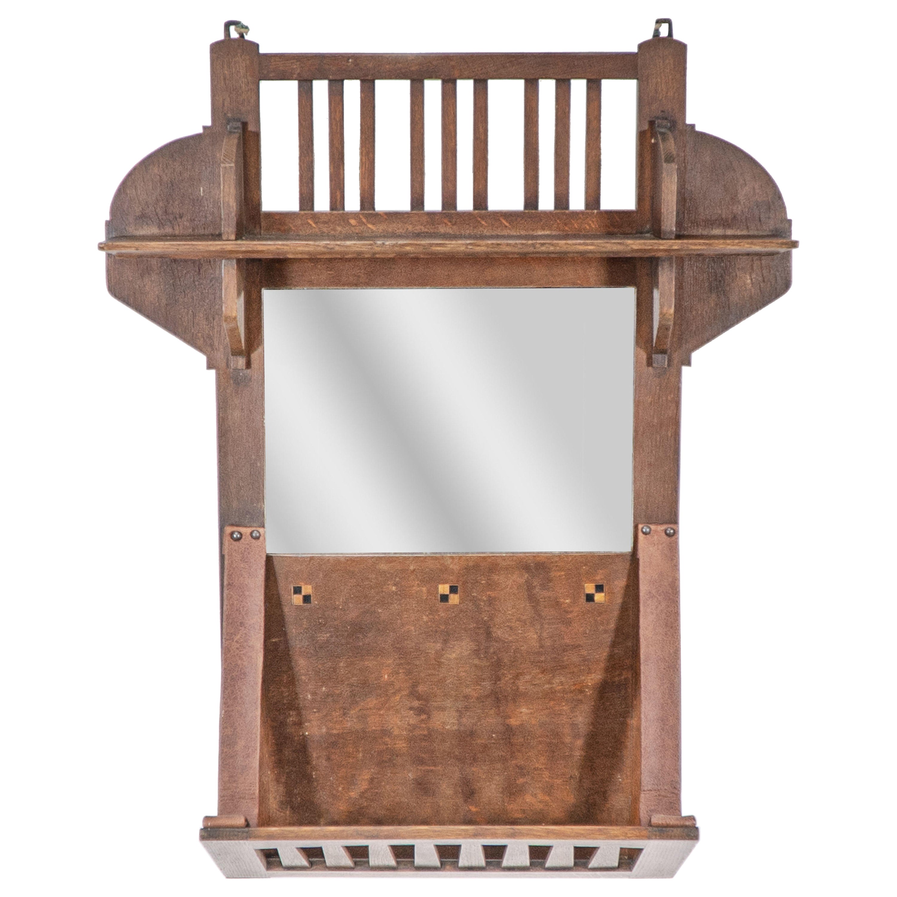 Liberty & Co. Un portacarte sospeso in rovere Arts & Crafts con specchio centrale in vendita