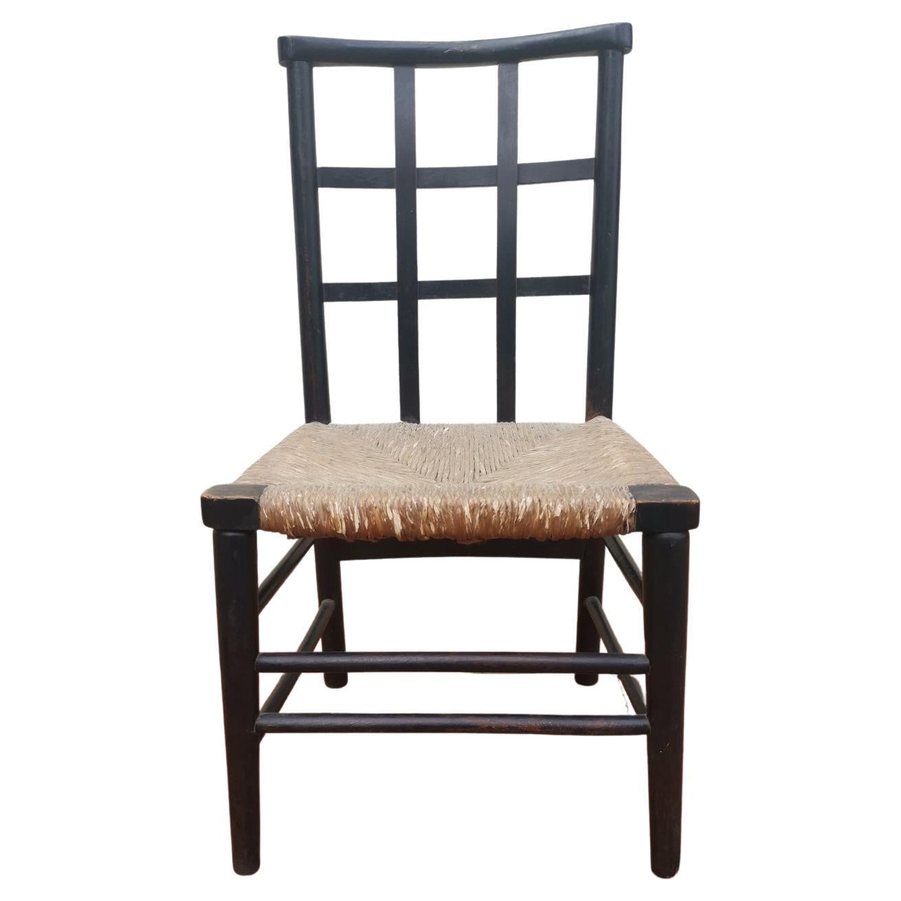 Liberty And Co. An English Beech Rush Seated Lattice Back Children's Chair For Sale