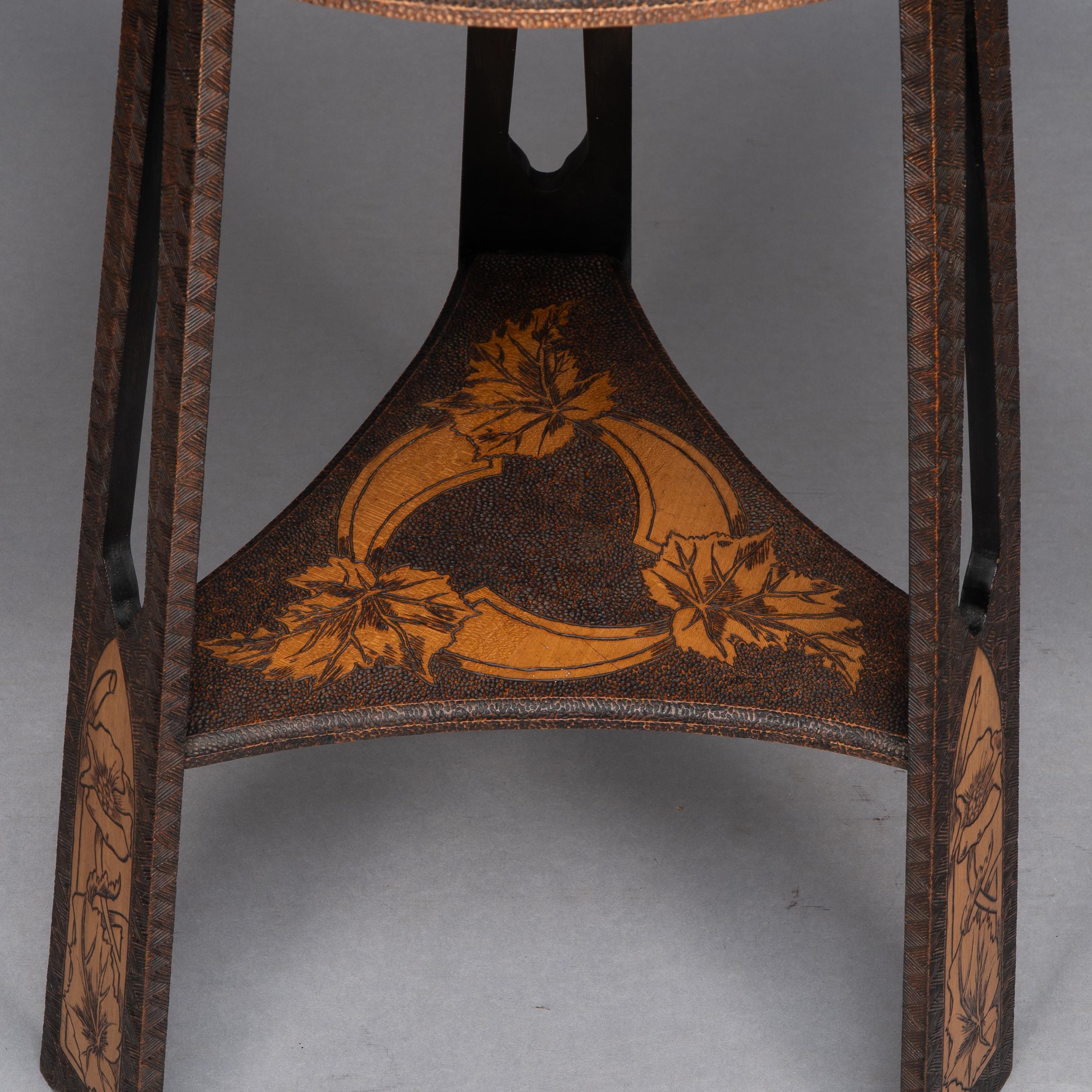 Liberty and Co. An intricately carved Arts and Crafts sidetable 7