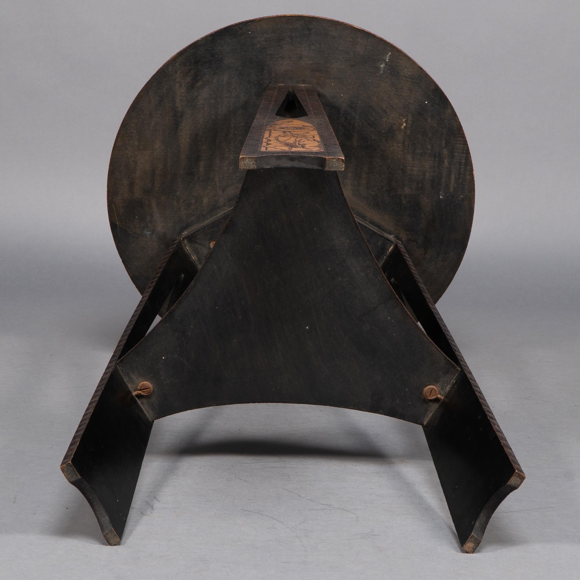 Liberty and Co. An intricately carved Arts and Crafts sidetable 9