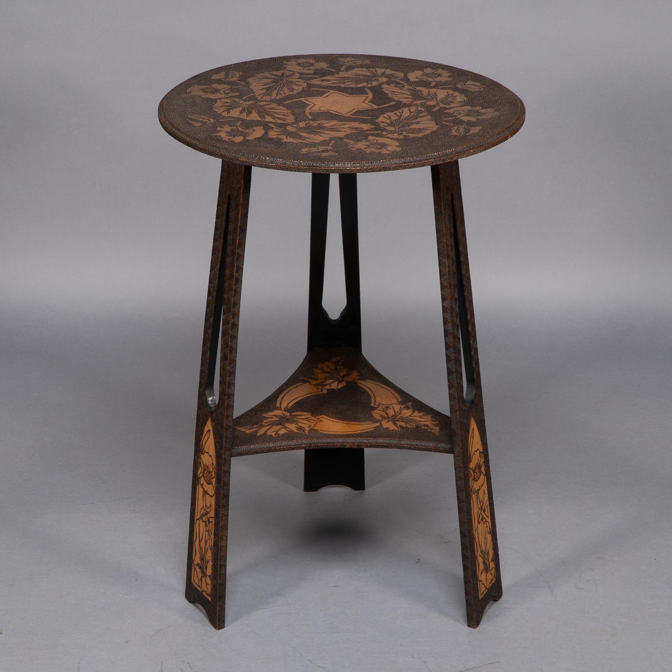 Liberty and Co. An intricately carved Arts and Crafts sidetable In Good Condition In London, GB
