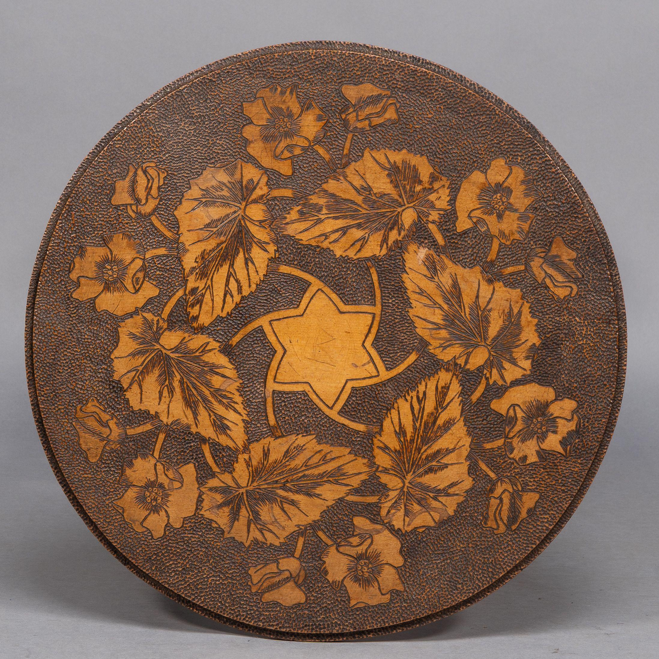 Liberty and Co. An intricately carved Arts and Crafts sidetable 2