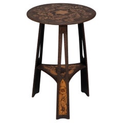 Liberty and Co. An intricately carved Arts and Crafts sidetable