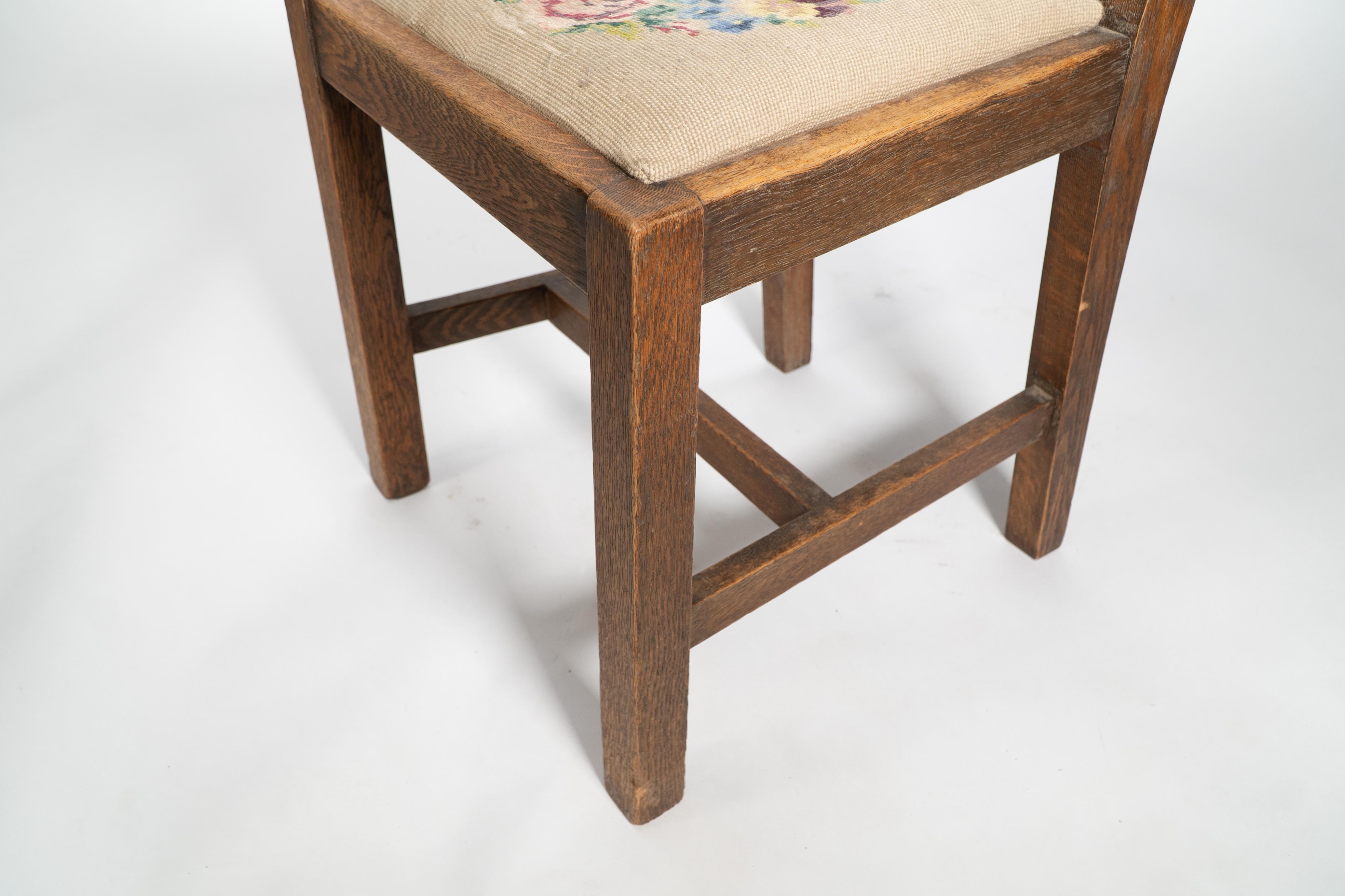 Liberty & Co. An Arts & Crafts oak chair with carved rose decoration to the back For Sale 7