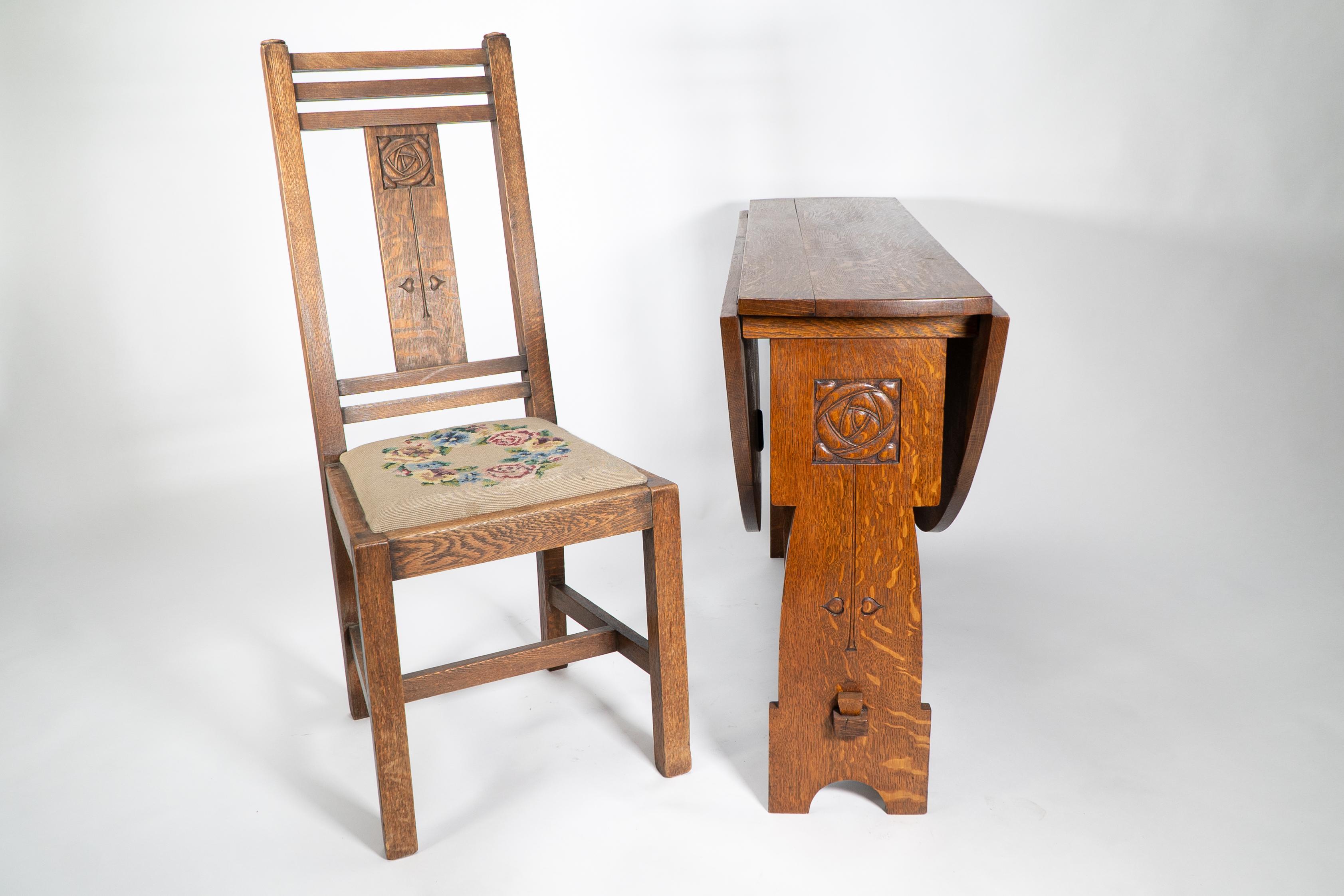 Liberty & Co. An Arts & Crafts oak chair with carved rose decoration to the back For Sale 10