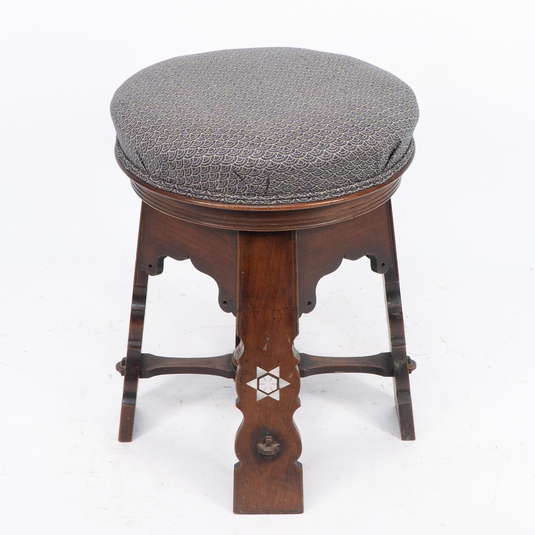 Early 20th Century Liberty and Co attri. A rare Moorish walnut revolving stool with Moorish arches For Sale