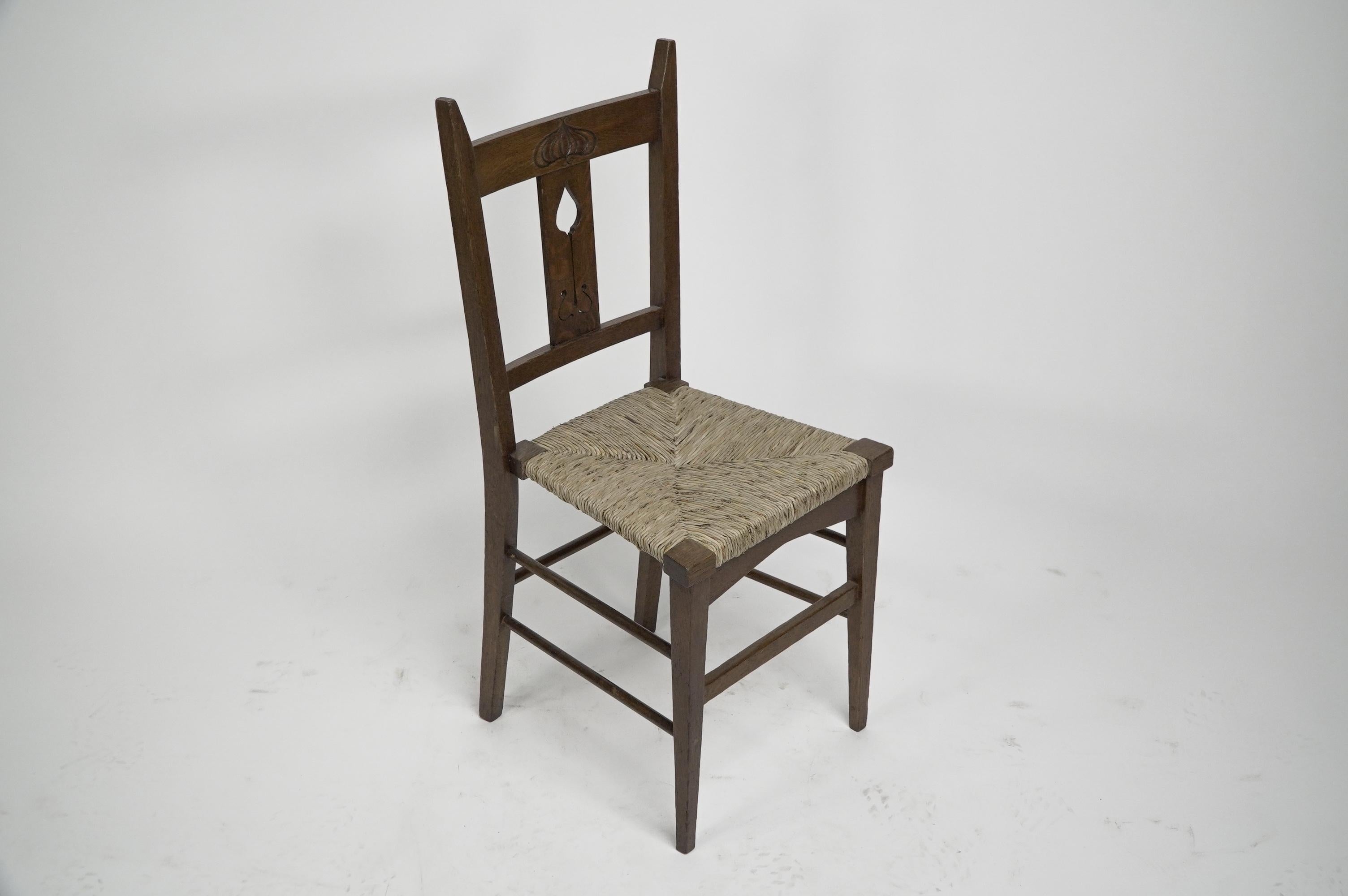 English Liberty & Co attributed. Set of six Glasgow Style oak & rush seat dining chairs. For Sale