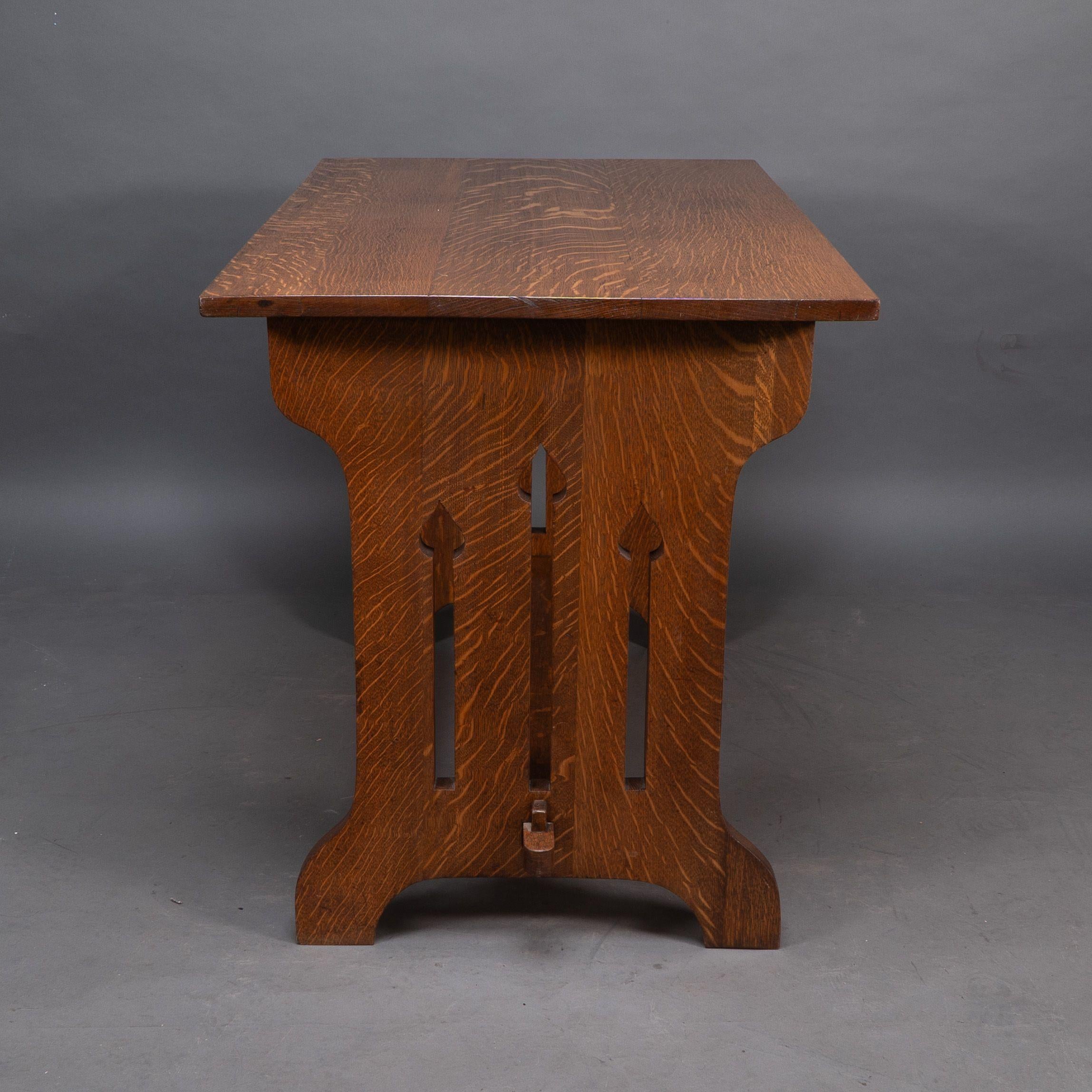 English Liberty and Co (attributed). A small Arts and Crafts oak dining table For Sale