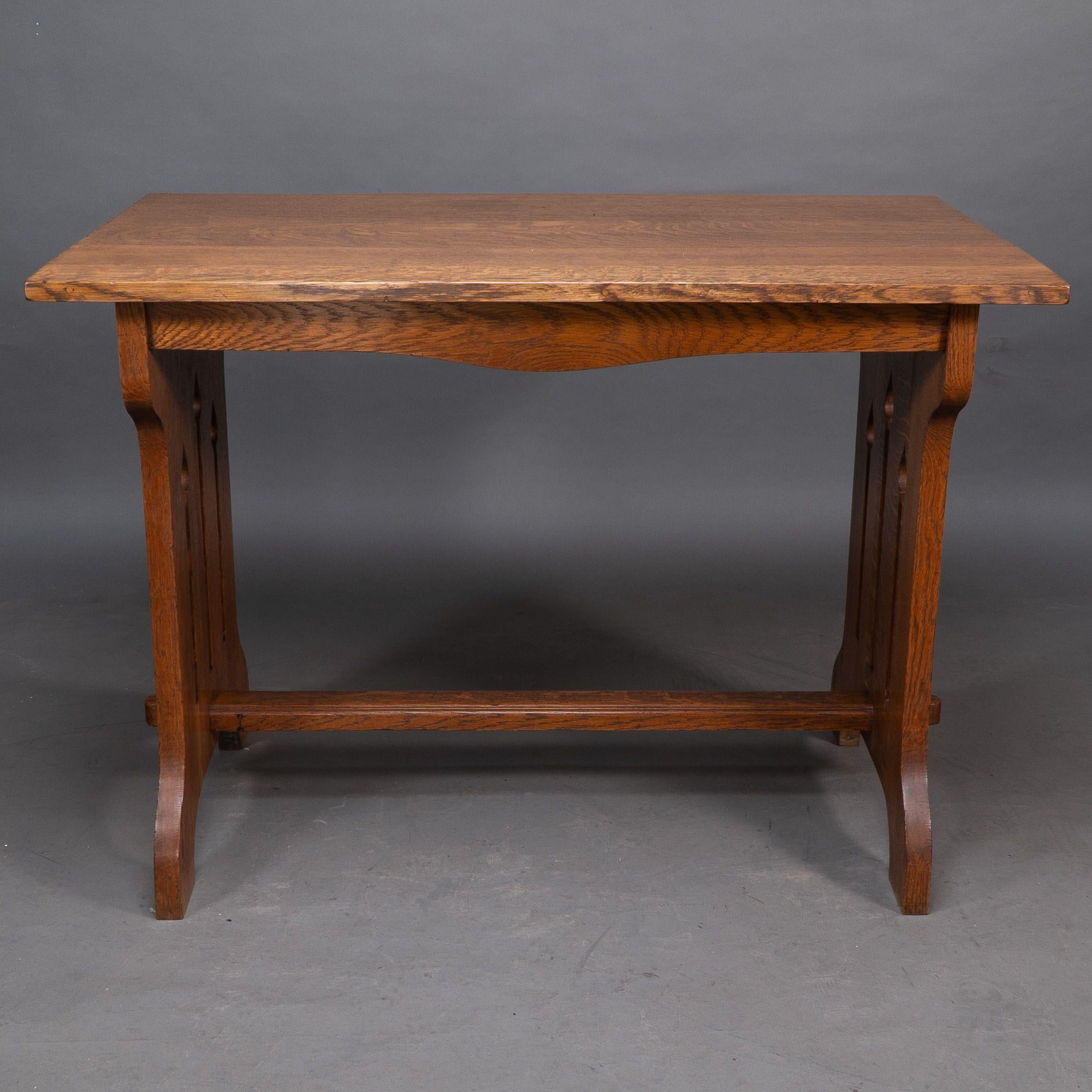 Early 20th Century Liberty and Co (attributed). A small Arts and Crafts oak dining table For Sale