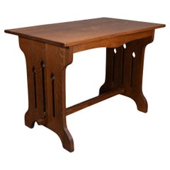 Antique Liberty and Co (attributed). A small Arts and Crafts oak dining table