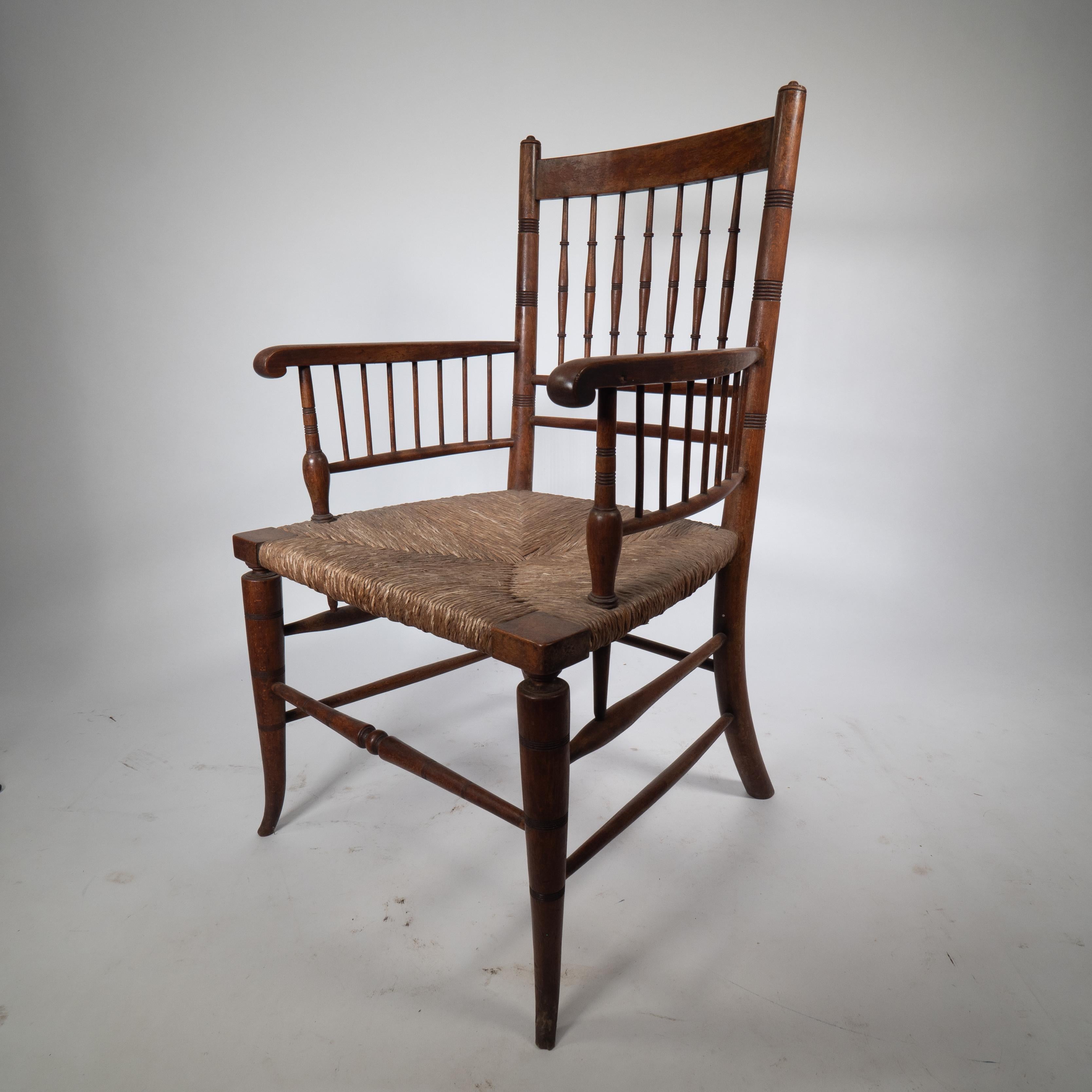 English Liberty and Co attributed An Aesthetic Movement rush seat armchair For Sale