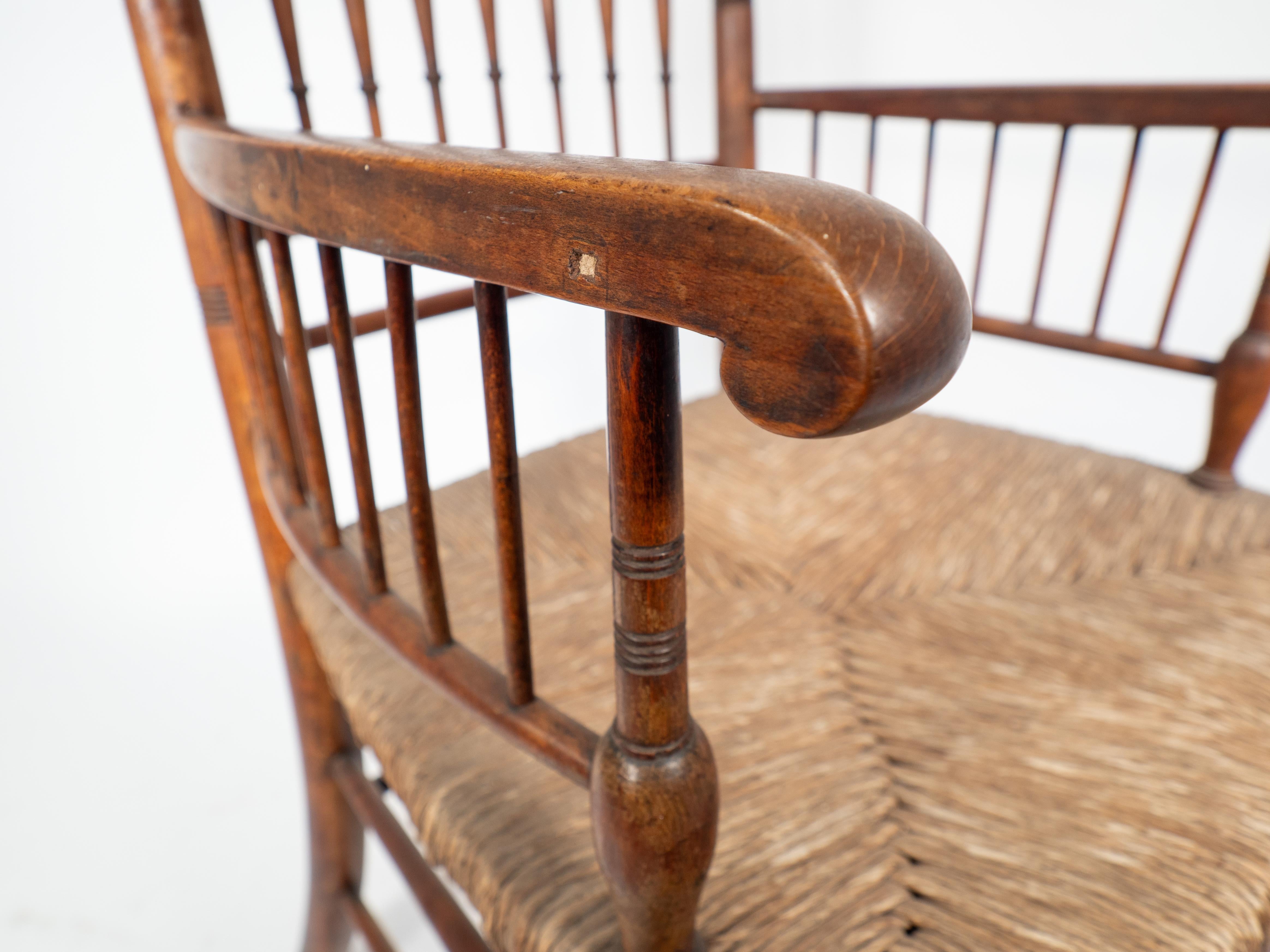 Late 19th Century Liberty and Co attributed An Aesthetic Movement rush seat armchair For Sale