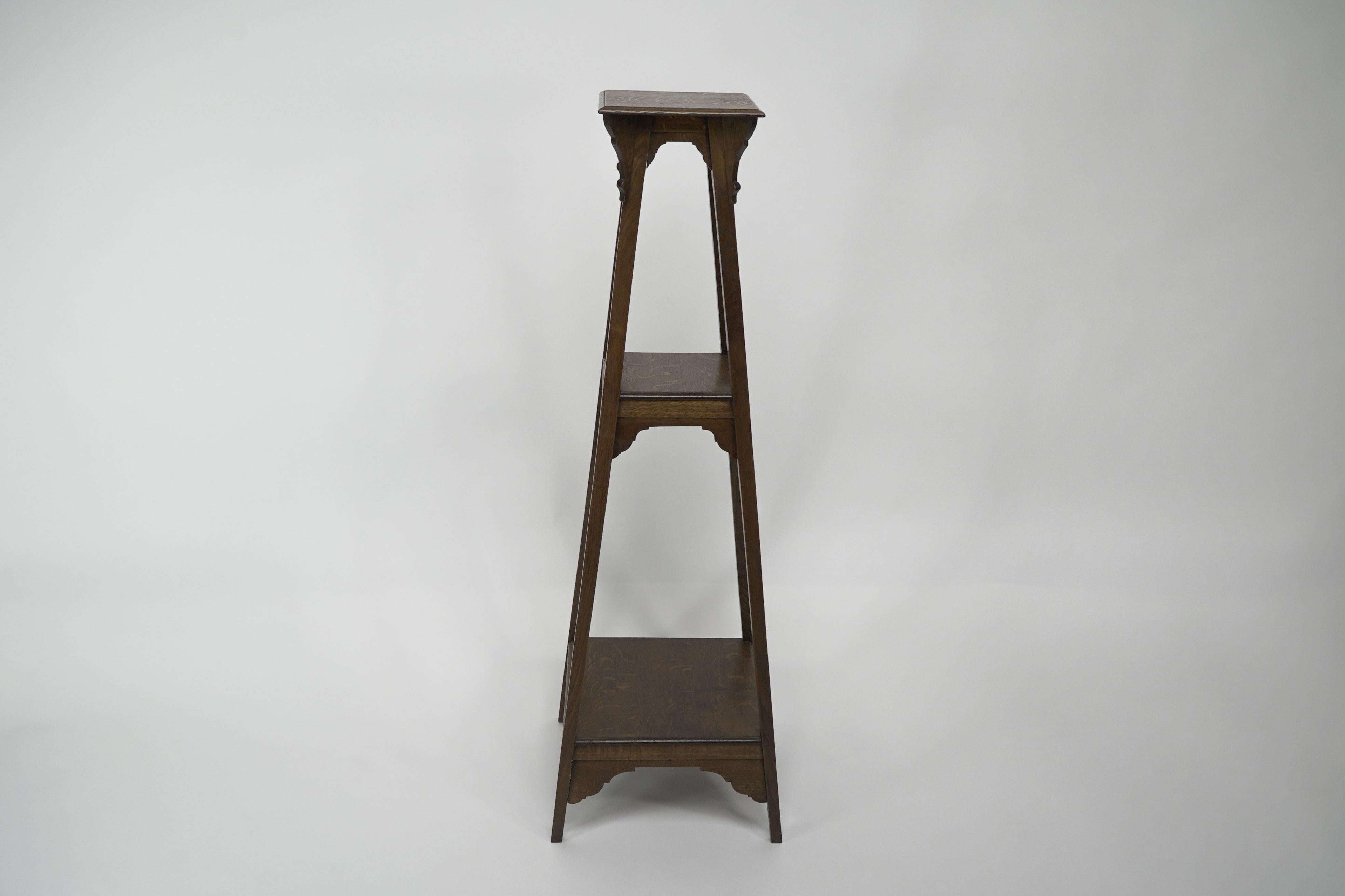 Late 19th Century Liberty and Co (attributed). An Arts and Crafts oak plant stand For Sale