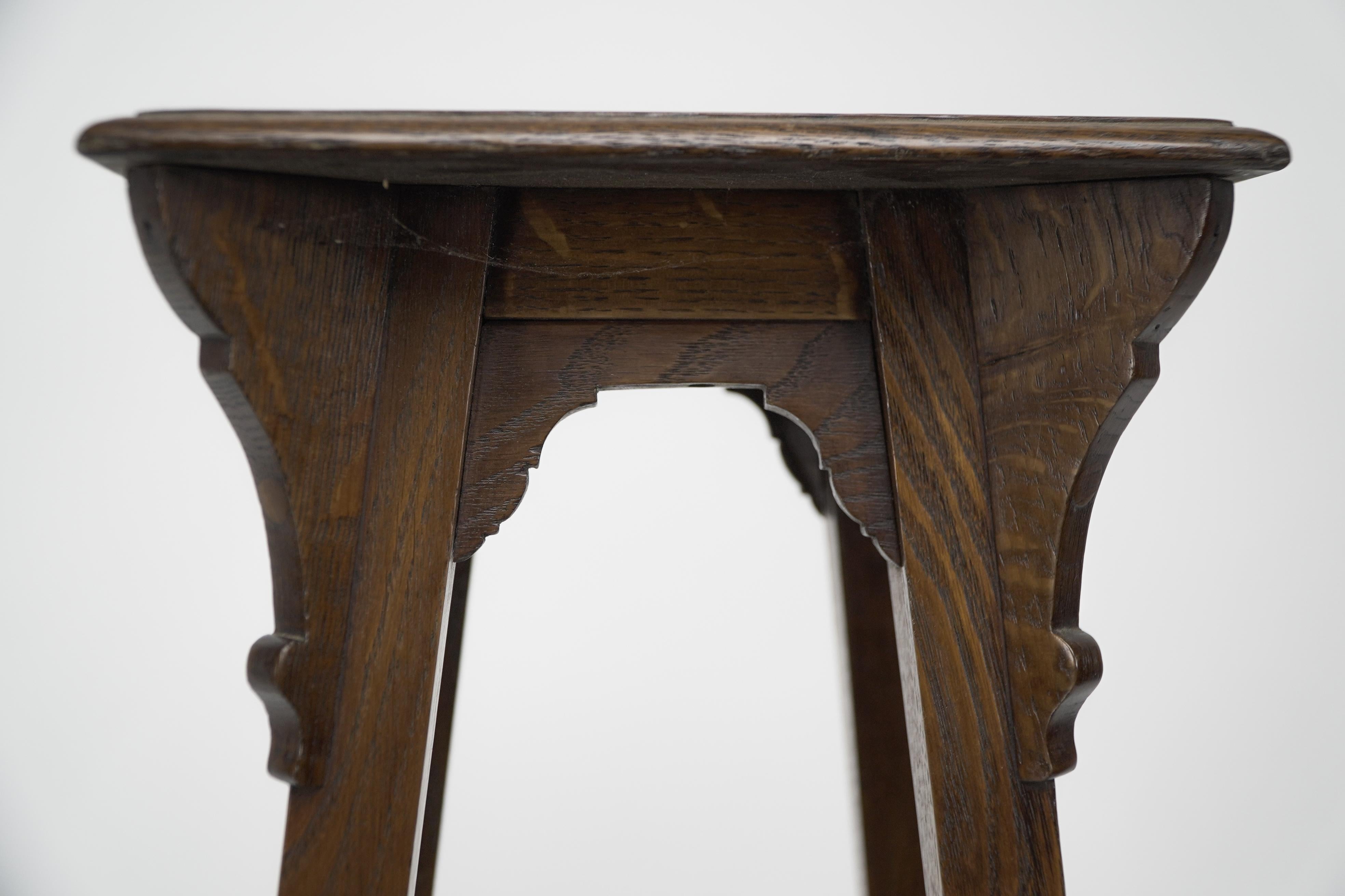 Liberty and Co (attributed). An Arts and Crafts oak plant stand For Sale 1