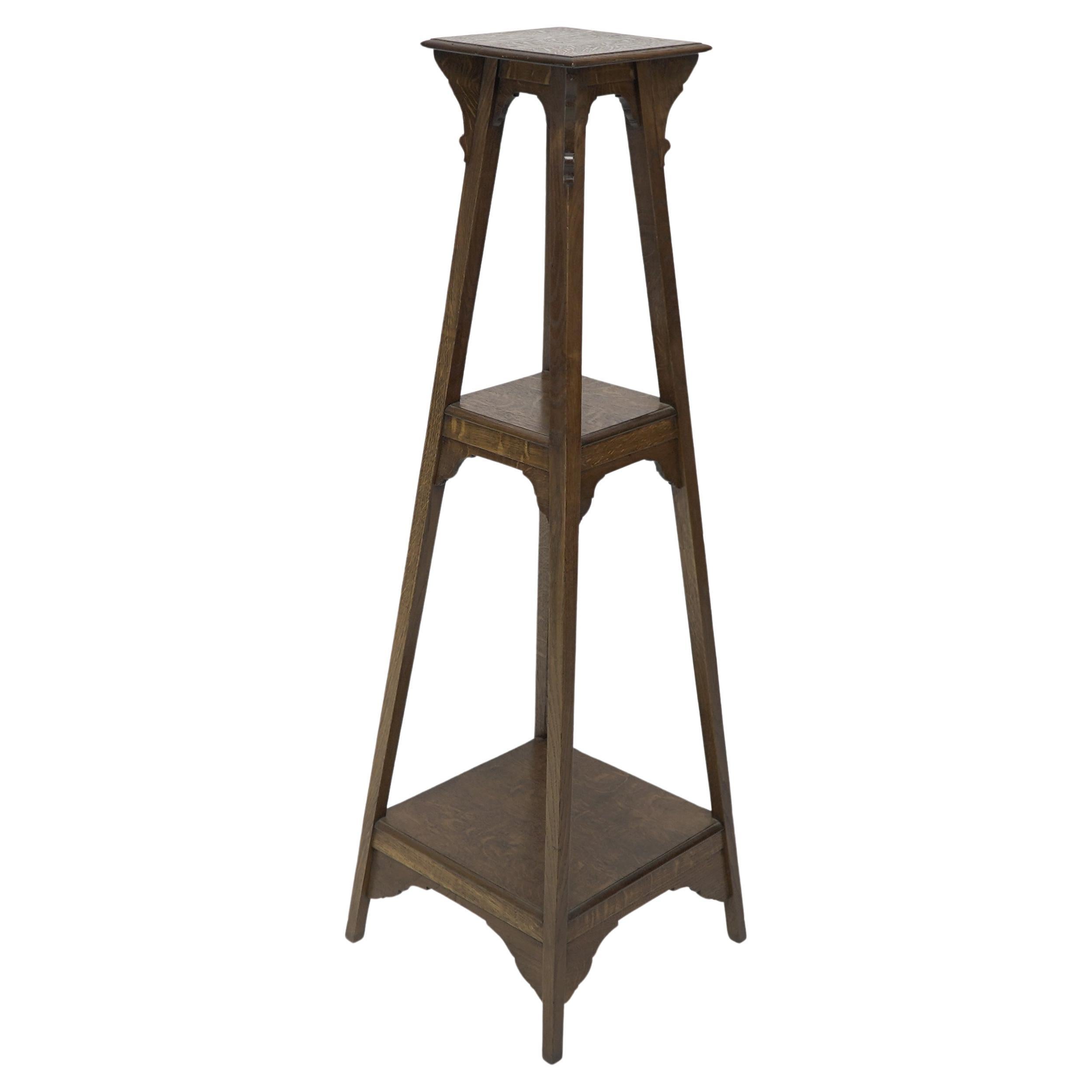 Liberty and Co (attributed). An Arts and Crafts oak plant stand For Sale