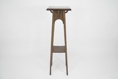 Liberty and Co (attributed). An Arts and Crafts Walnut plant stand.