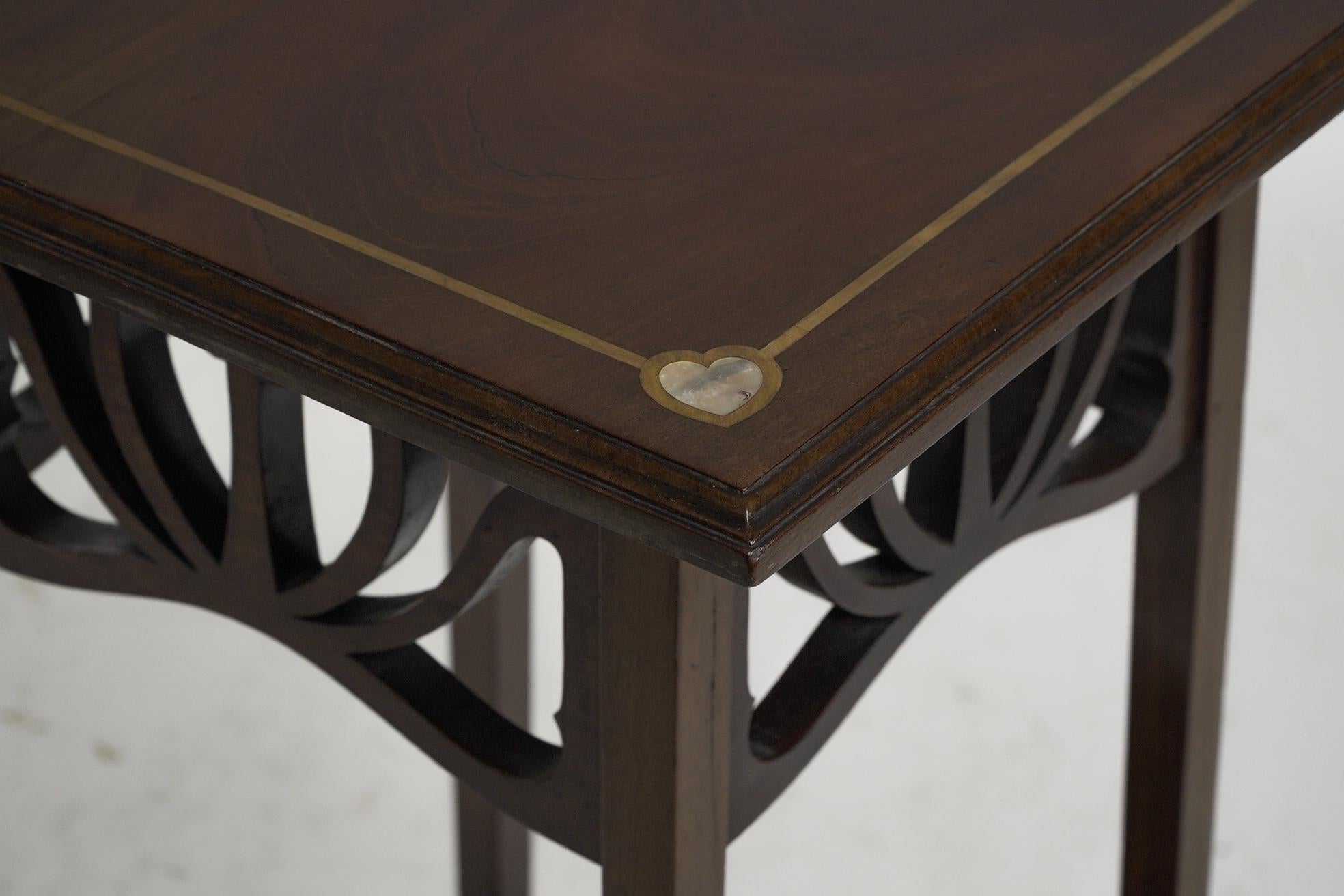 Liberty and Co (attributed). A mahogany occasional table with Mother-Of-Pearl For Sale 1