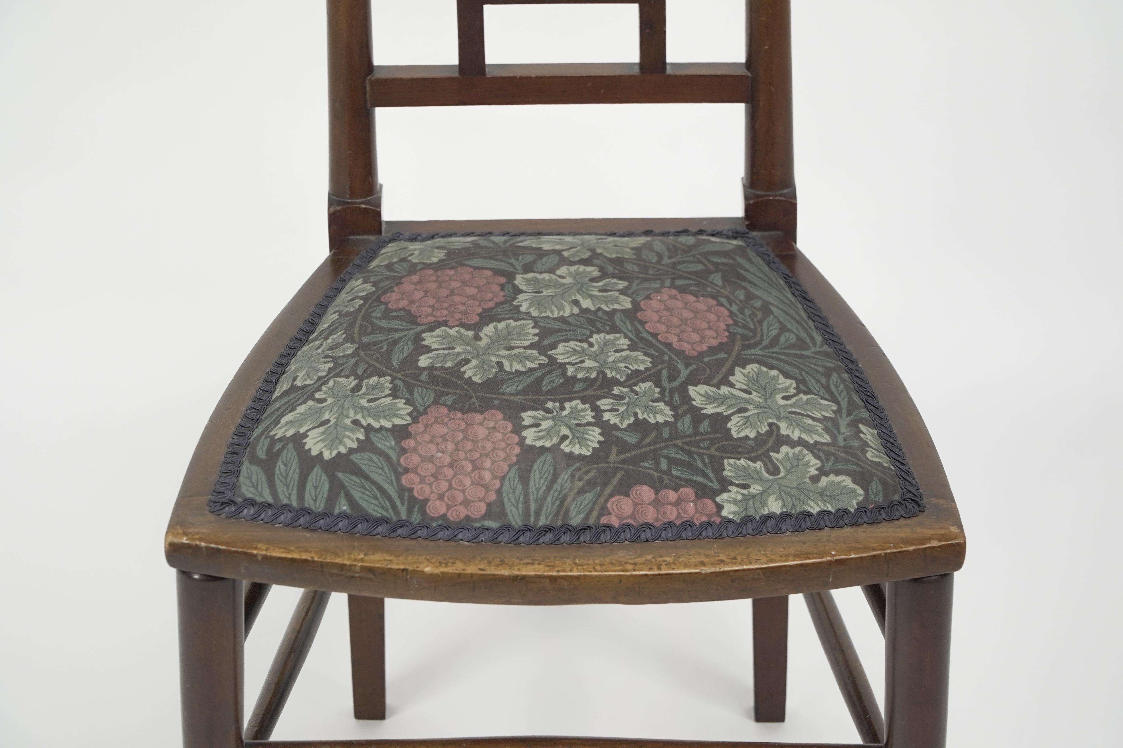 E G Punnett for Liberty & Co. A Walnut side chair with inlaid floral decoration. For Sale 3