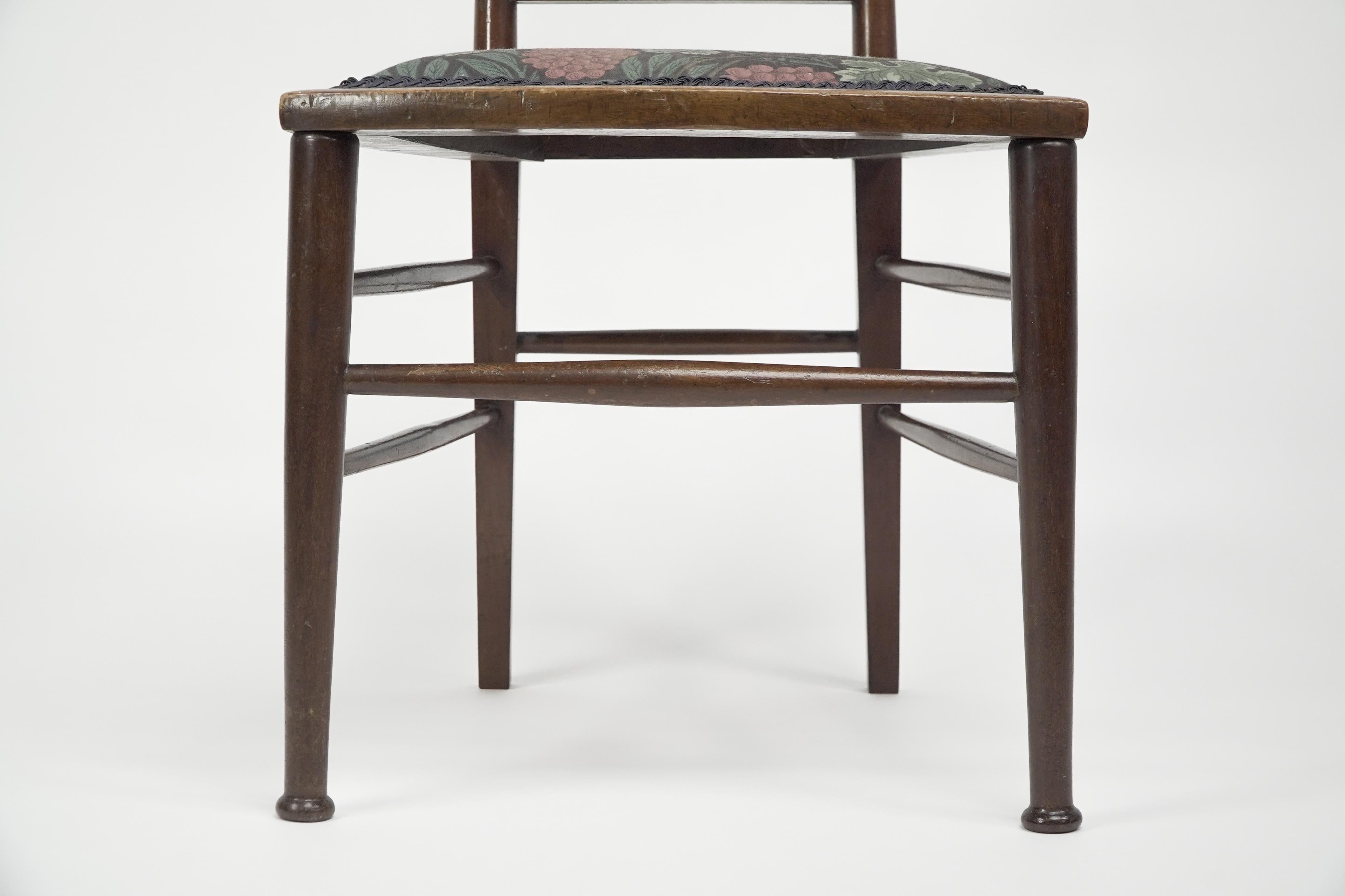 E G Punnett for Liberty & Co. A Walnut side chair with inlaid floral decoration. For Sale 4