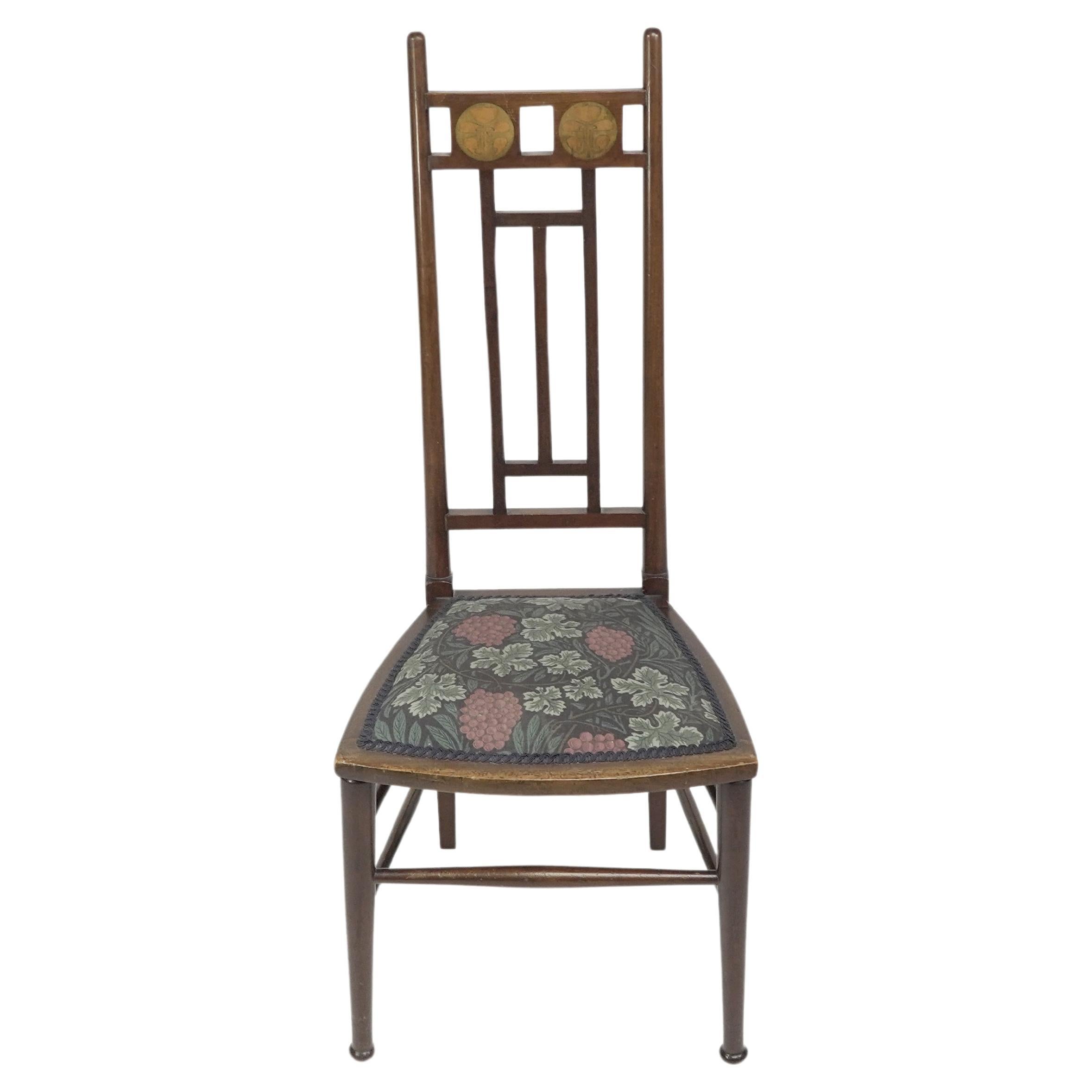 E G Punnett for Liberty & Co. A Walnut side chair with inlaid floral decoration. For Sale
