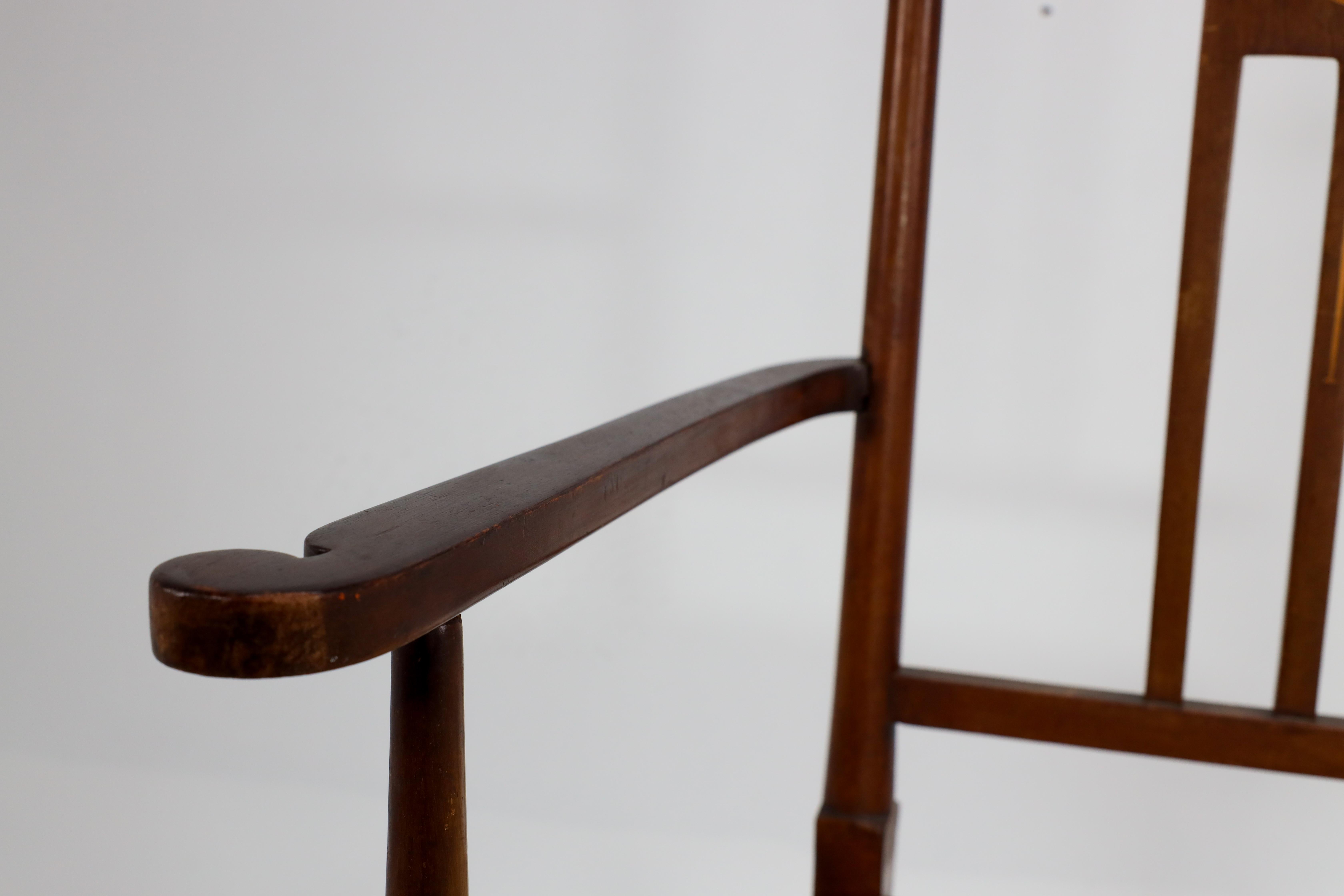 Liberty and Co in the style of G M Ellwood. An Arts and Crafts Walnut armchair For Sale 8