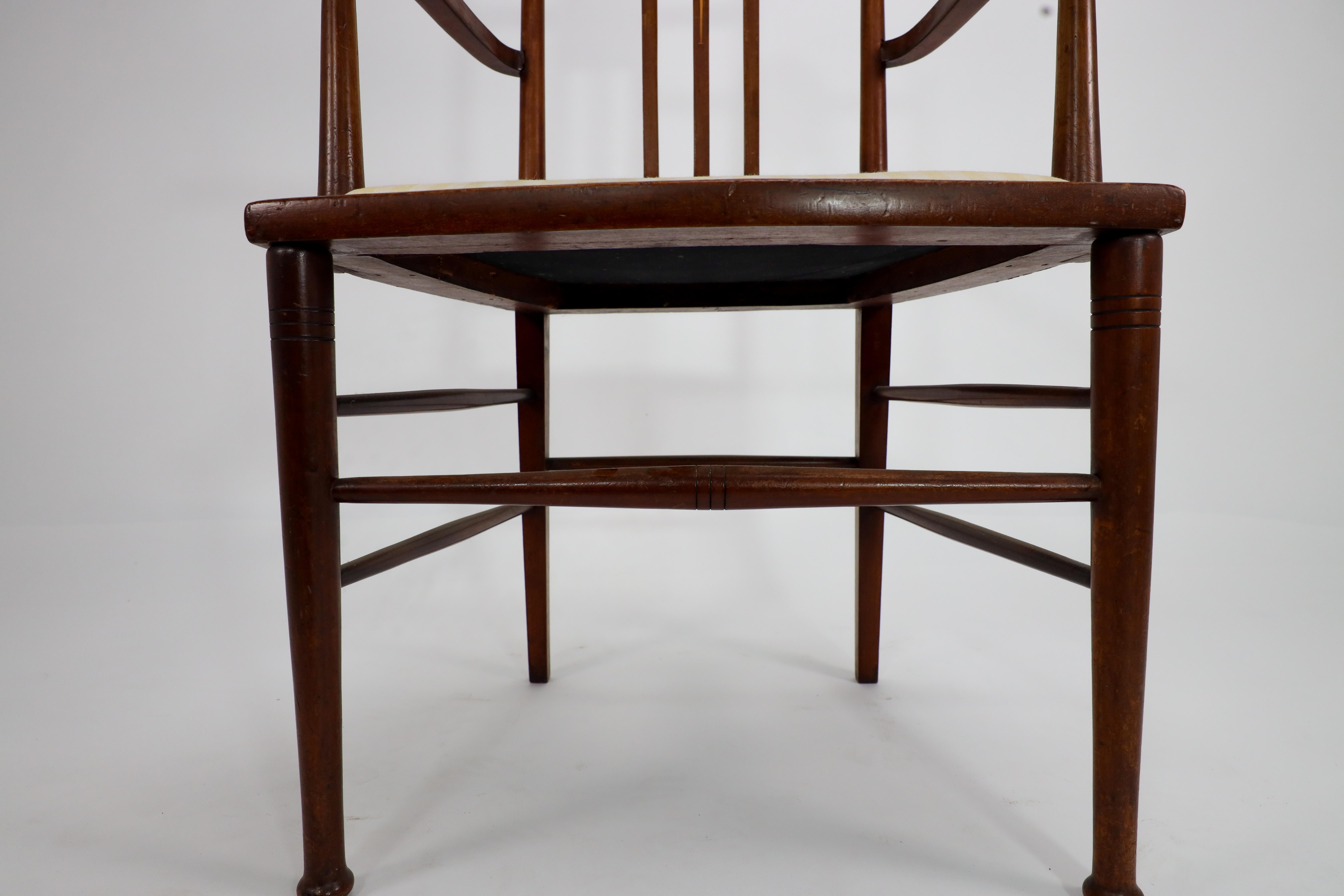 Liberty and Co in the style of G M Ellwood. An Arts and Crafts Walnut armchair For Sale 9